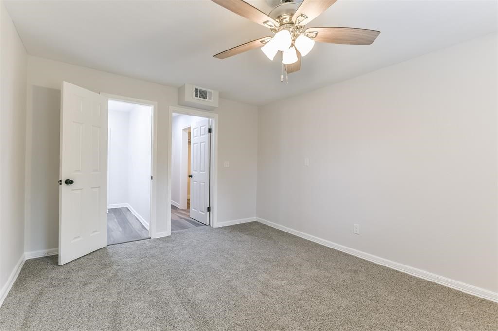 Spacious Primary Suite in back of the home with Ceiling Fan