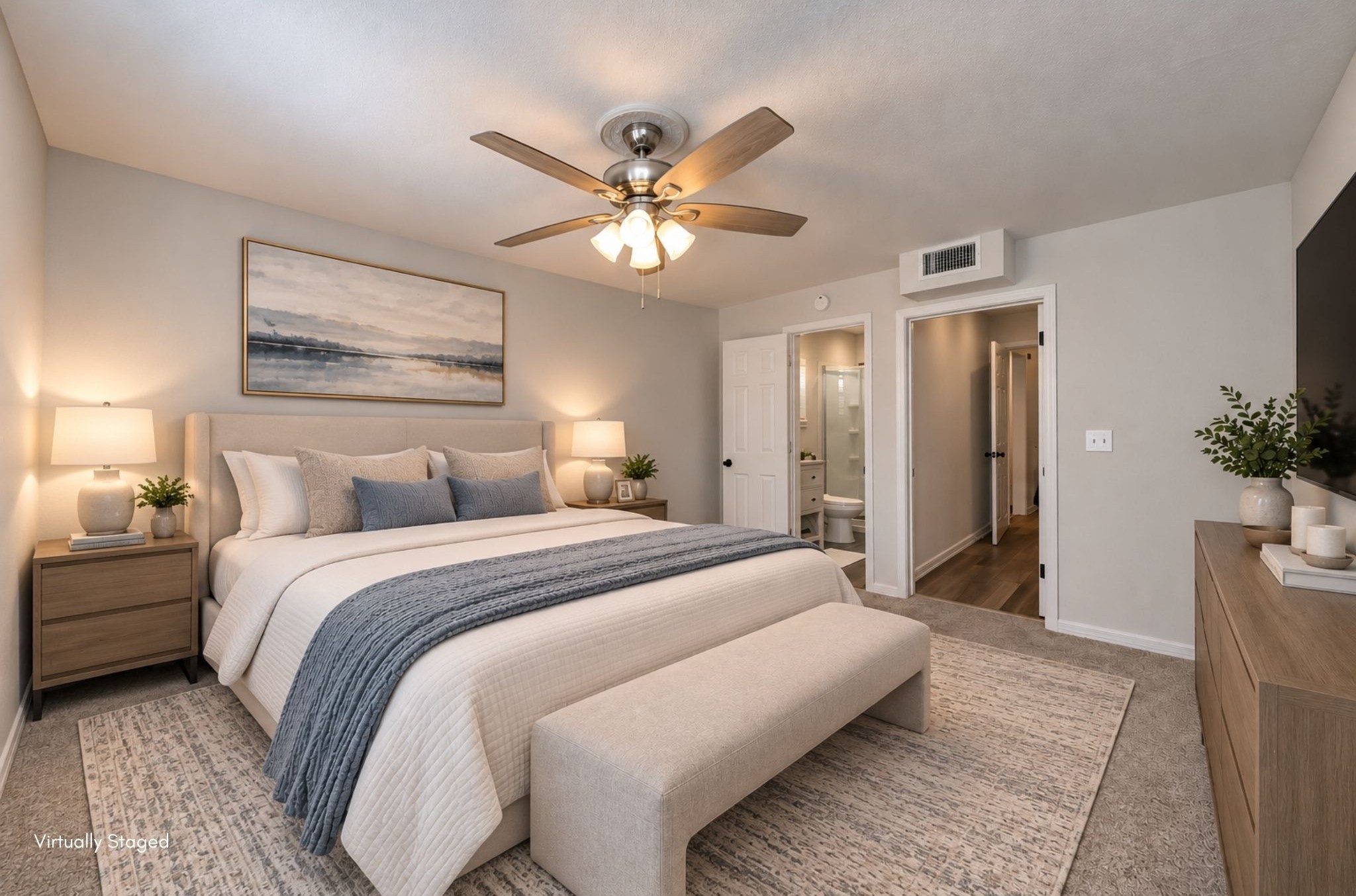 Virtually staged primary bedroom to assist with visualizing furniture in the home.
