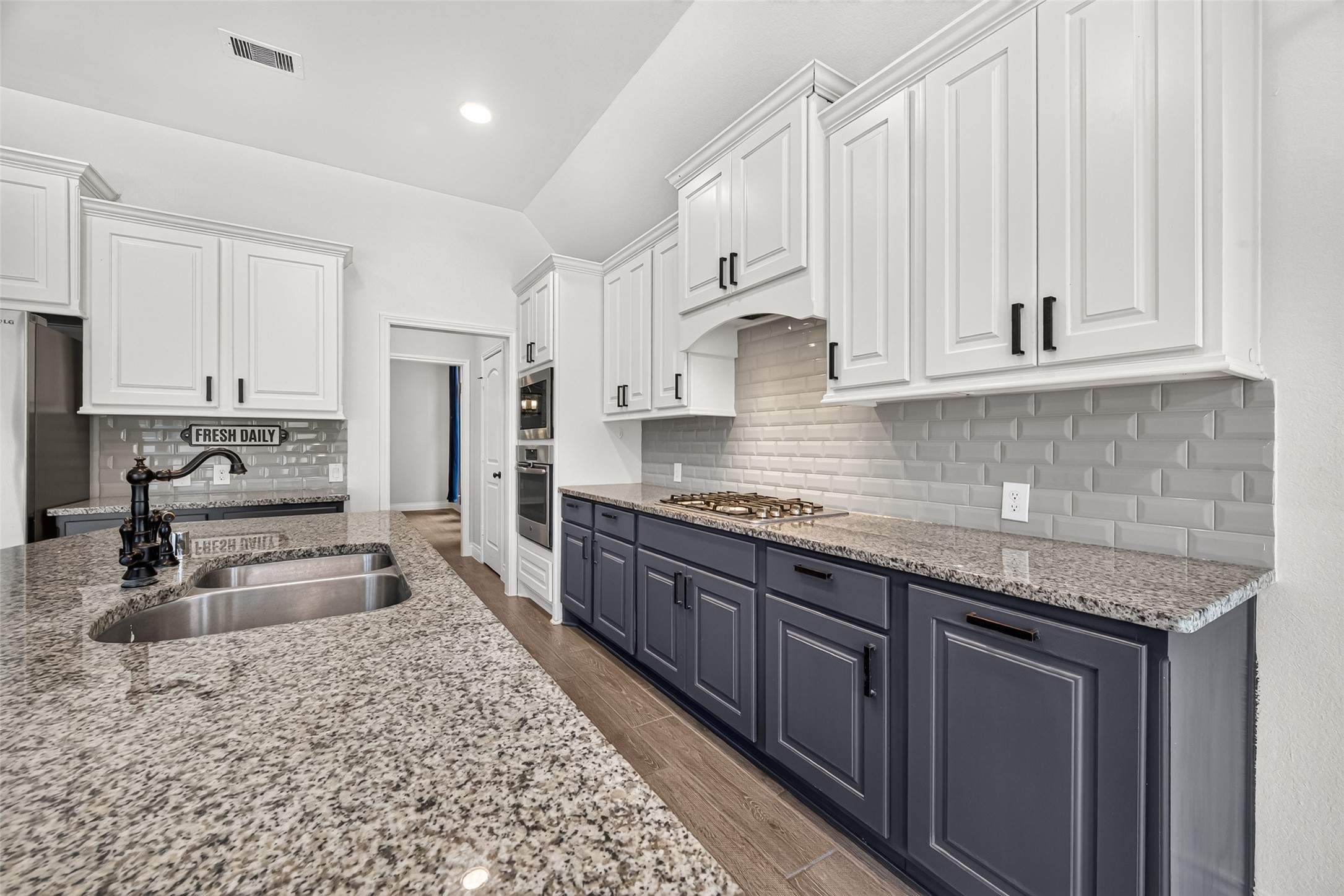 Modern kitchen with granite countertops.