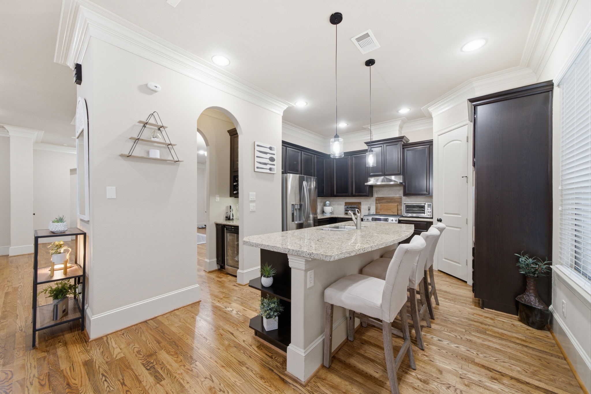 Gourmet kitchen with large island with seating space.  Generous sized walk in pantry offers added storage.