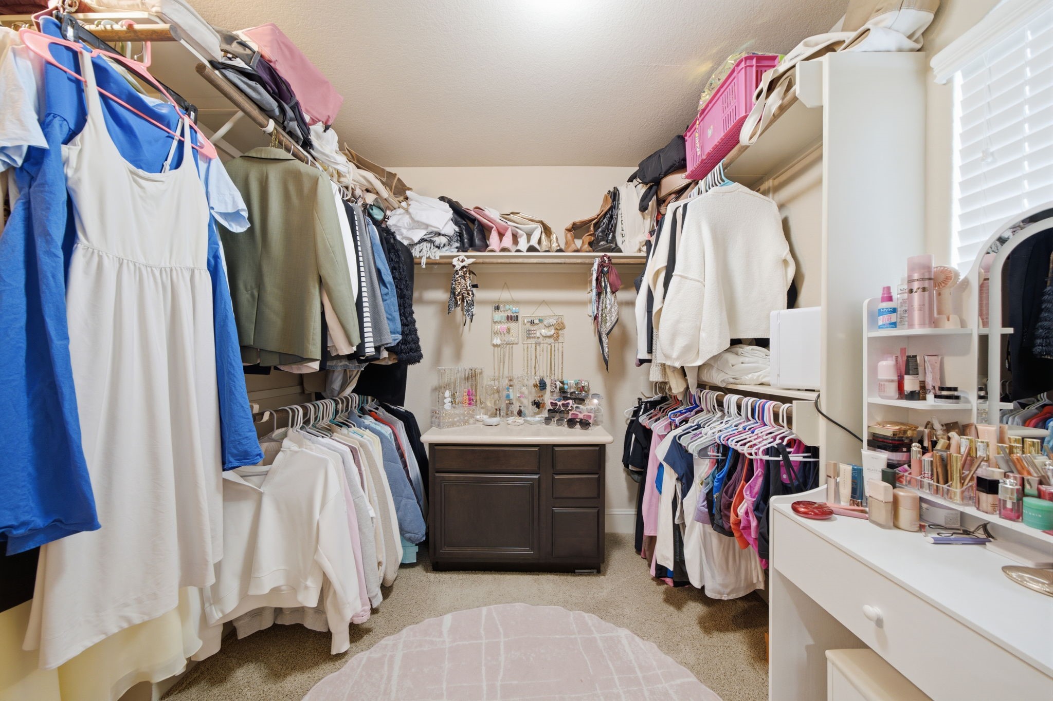 Most closets are not photo worthy but this one is amazing!  This is just ONE of the TWO primary bedroom closets. 
 Built in cabinetry and room for a vanity.