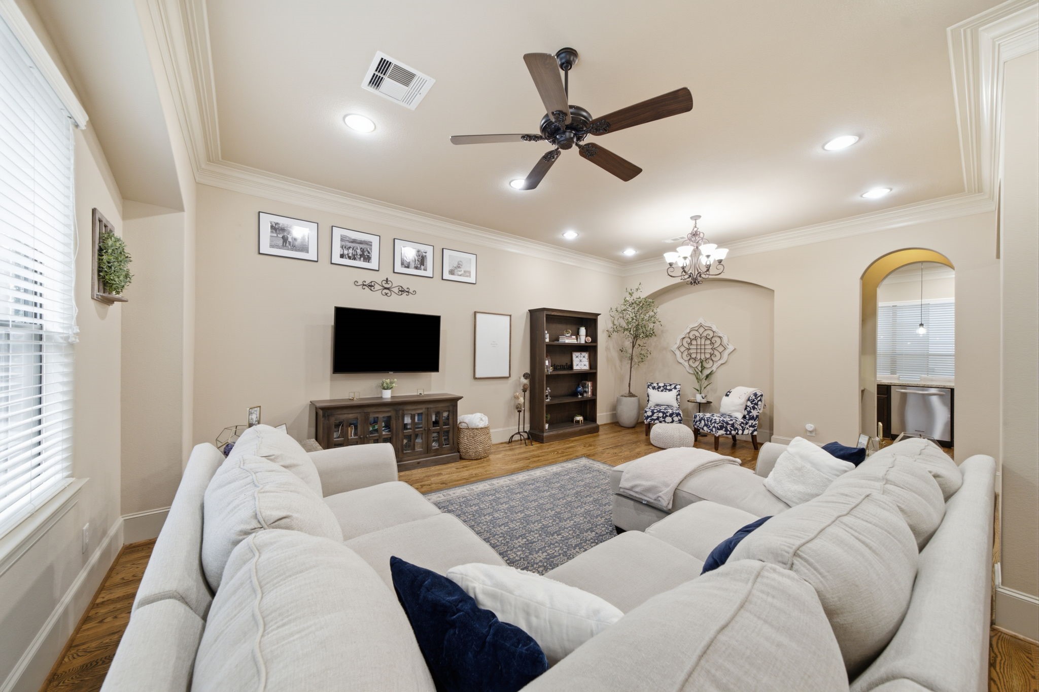 The Mediterranean influence of this home is continued with the arched niche and doorways.