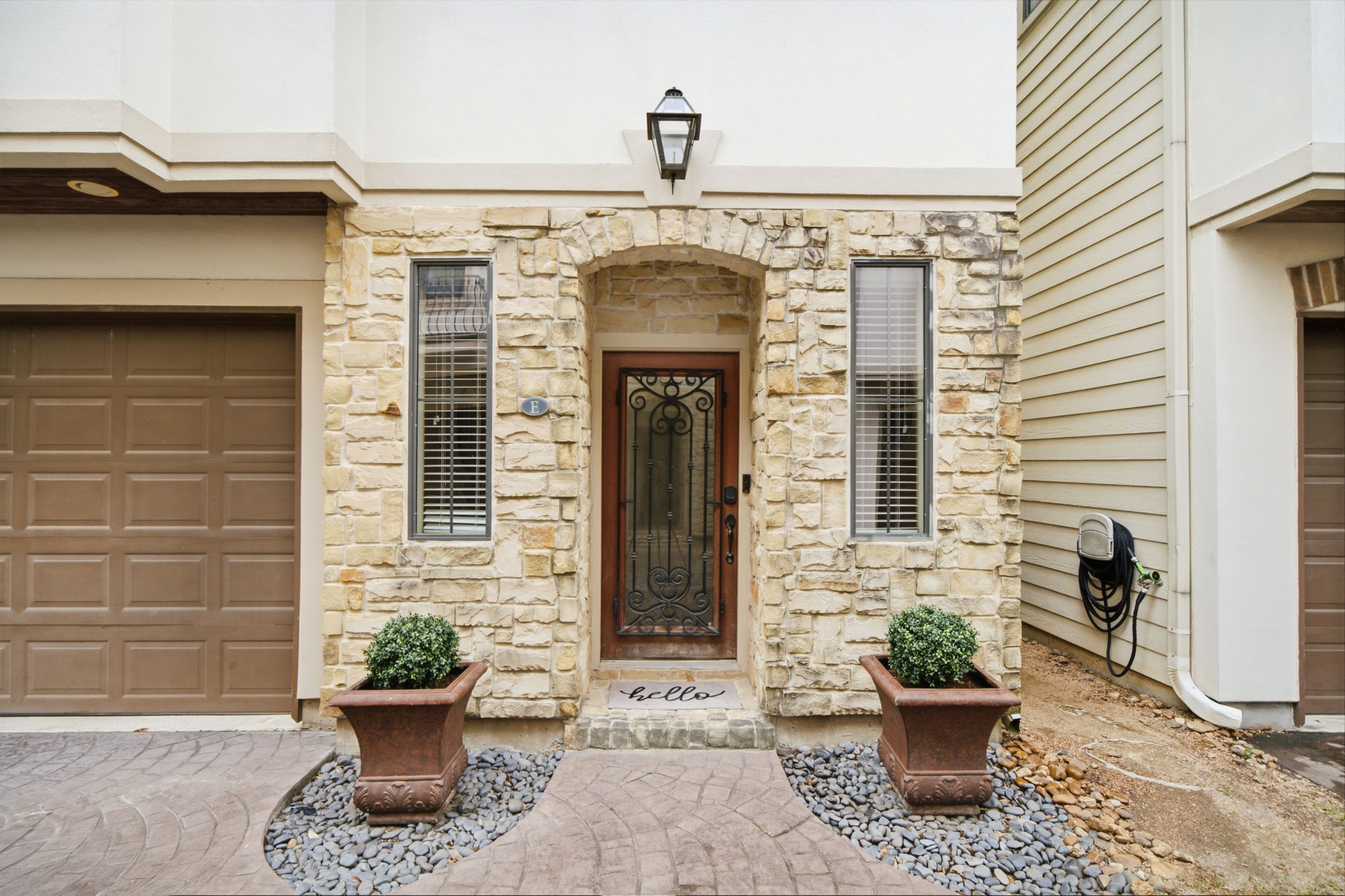 This graceful entry with stone and stucco welcomes you! This graceful entry with stone and stucco welcomes you!