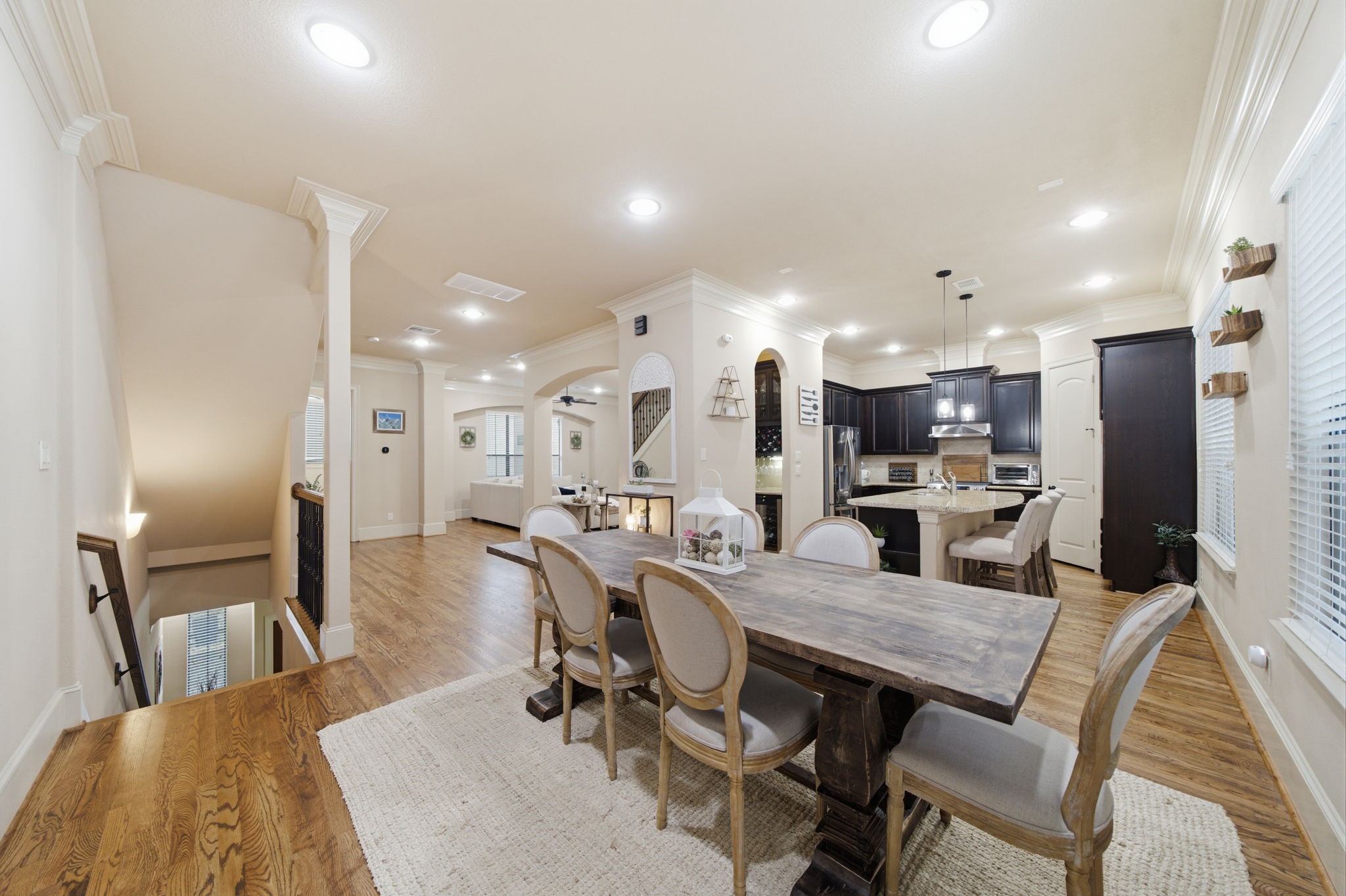 The entertaining level of this home has easy flow between living/dining/kitchen areas, all highlighted by the high ceilings and triple crown molding.