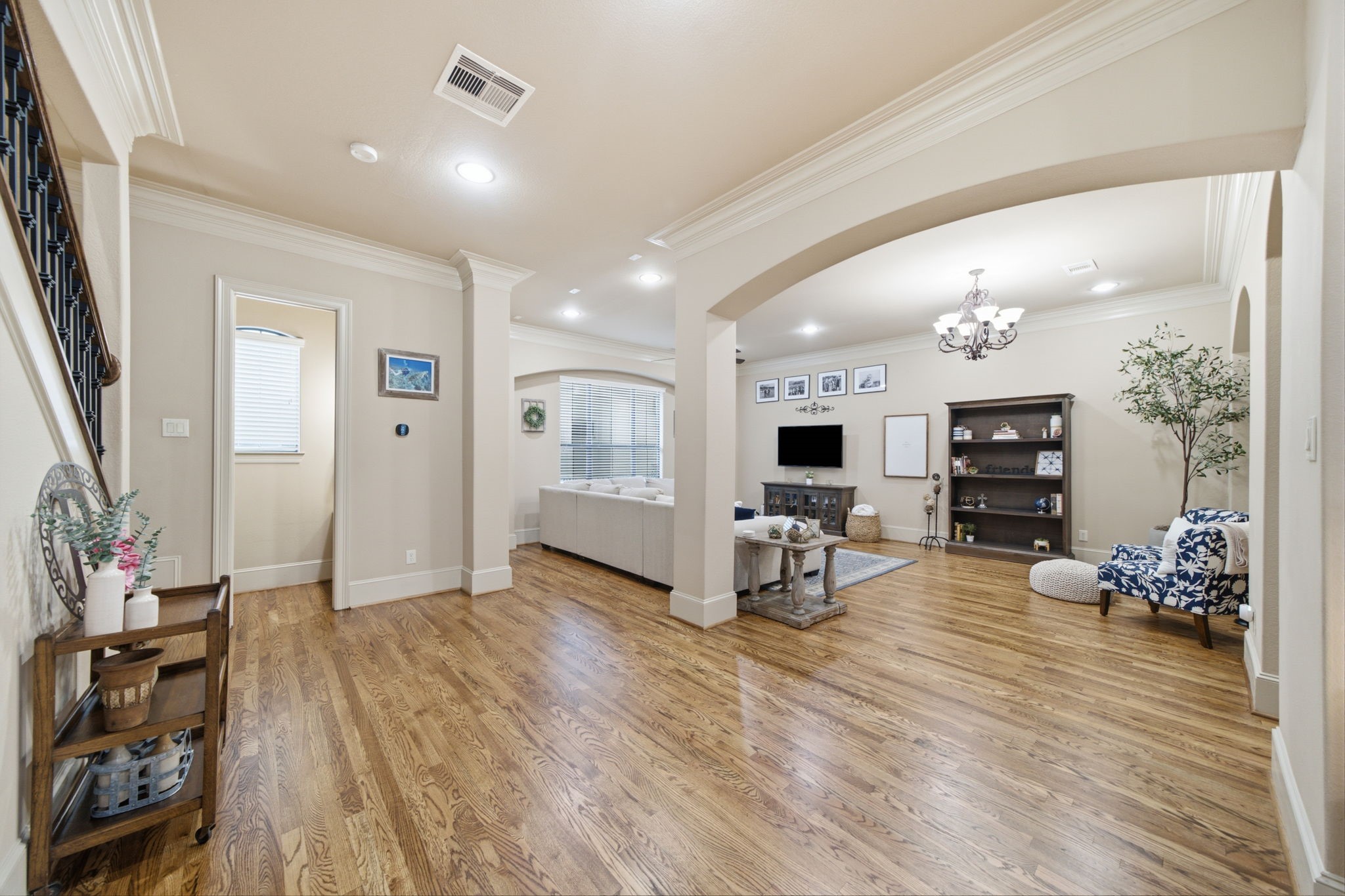The living level has new hardwood floors with graceful arches and recessed lighting.