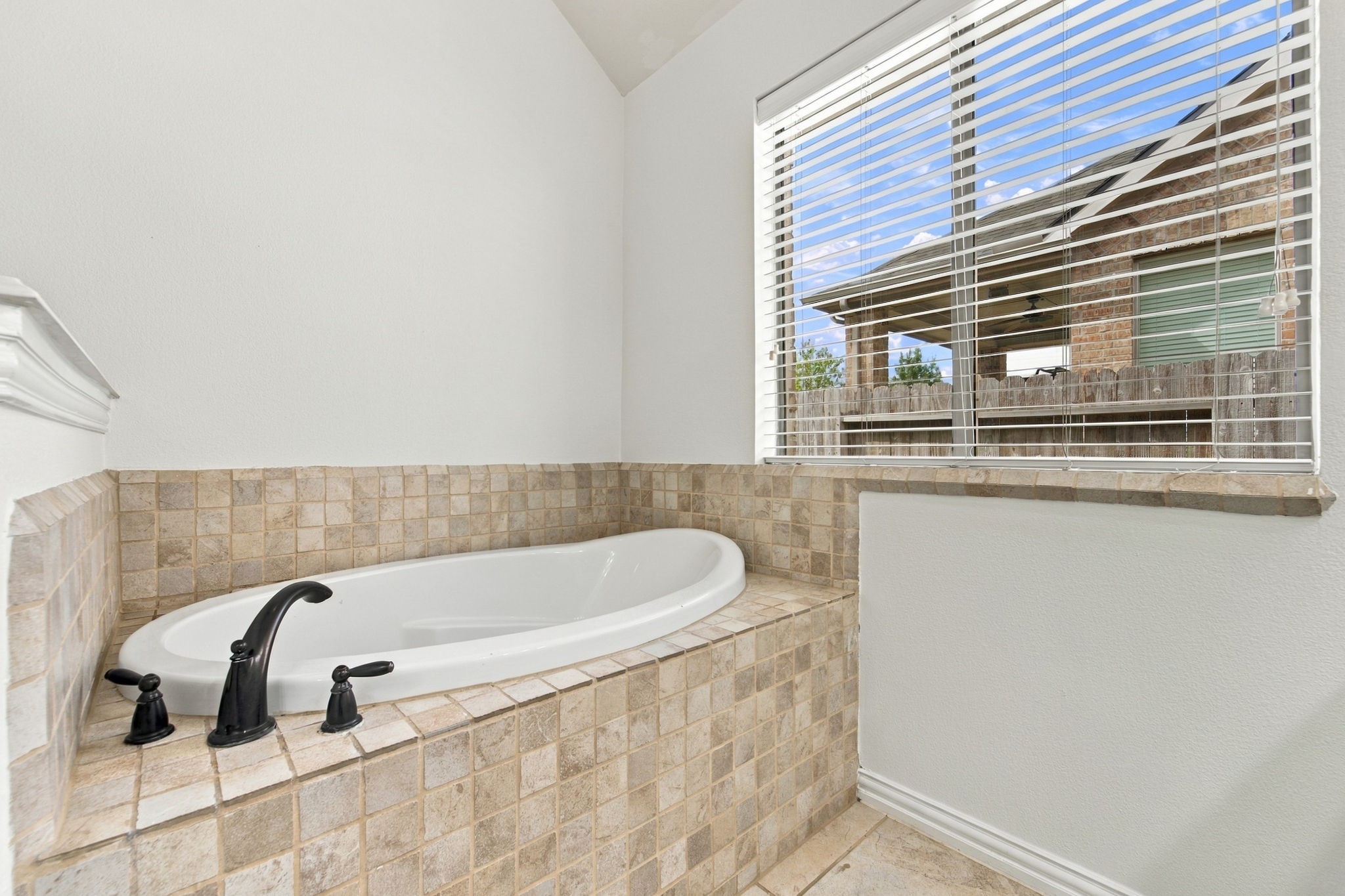 Primary bath soaking tub, ready for a relaxing end to the day.