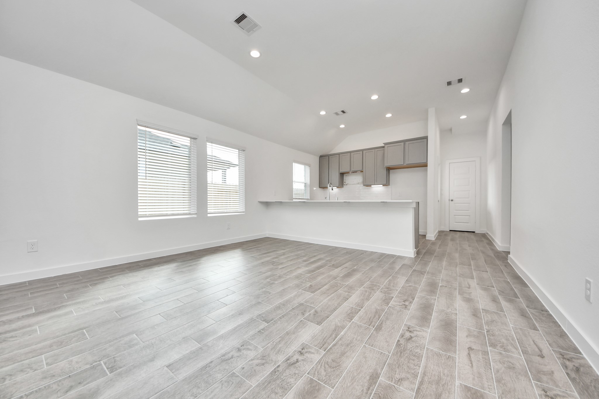 Make memories gathered around the table with your family and friends! This spacious dining room features elegant flooring, custom paint, and adjacent to family room and kitchen for open concept feel. Sample photo of completed home with similar floor plan. Actual colors and selections may vary.