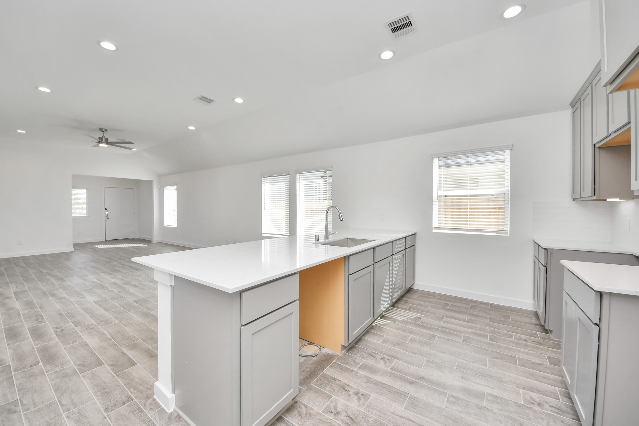 The open concept effortlessly connects the kitchen to the expansive family room, forming a perfect hub for gatherings. This seamless flow creates an inviting space where cooking and socializing come together harmoniously. Sample photo of completed home with similar floor plan. Actual colors and selections may vary.
