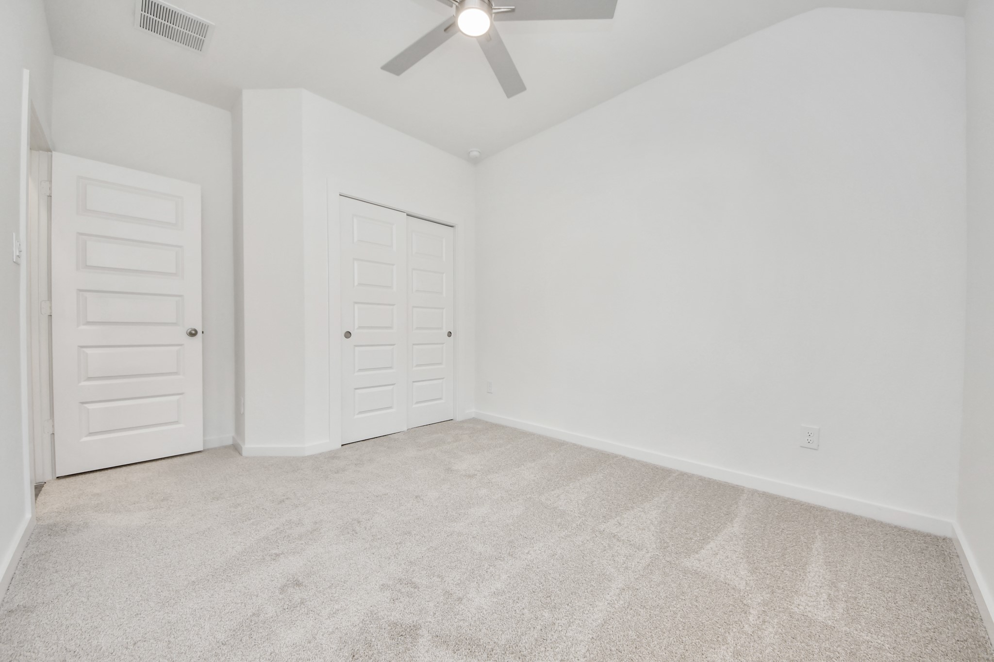Generously sized secondary bedrooms featuring spacious closets, soft and inviting carpeting underfoot, large windows allowing plenty of natural light, and the added touch of privacy blinds for your personal retreat. Sample photo of completed home with similar floor plan. Actual colors and selections may vary.