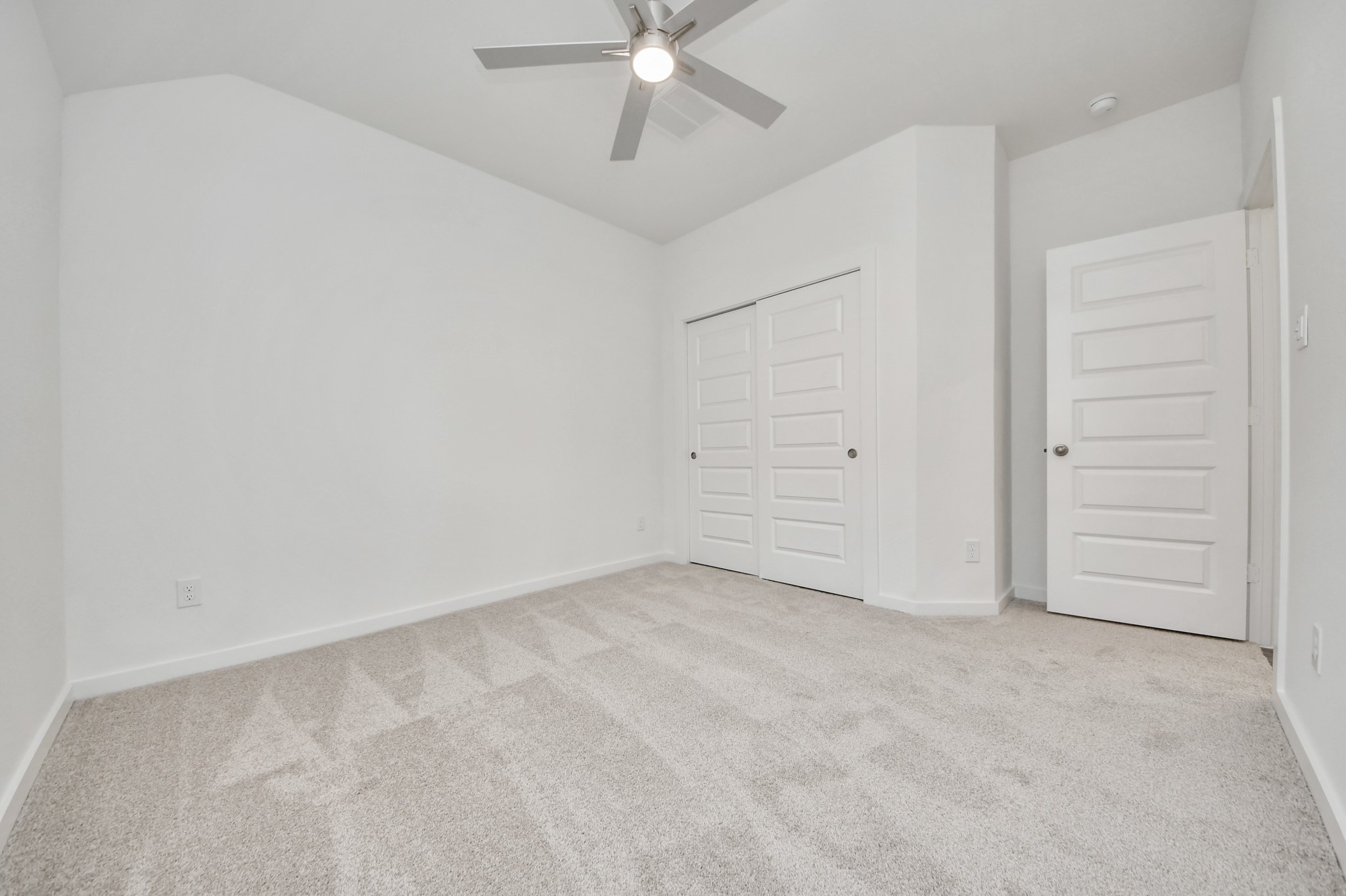 Generously sized secondary bedrooms featuring spacious closets, soft and inviting carpeting underfoot, large windows allowing plenty of natural light, and the added touch of privacy blinds for your personal retreat. Sample photo of completed home with similar floor plan. Actual colors and selections may vary.