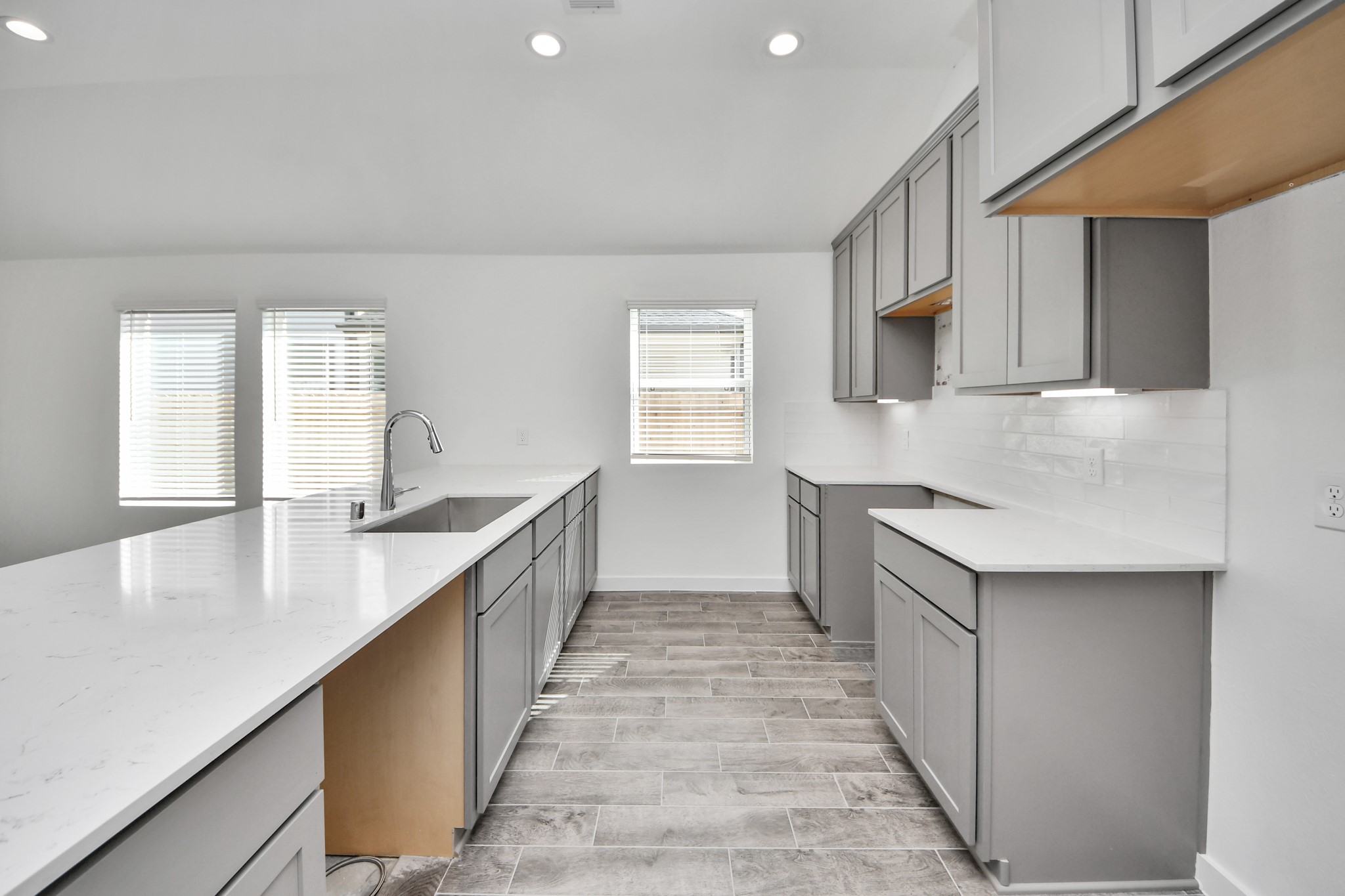 The extended counter area adds both practicality and style, making meal preparation a breeze. Every detail is thoughtfully designed to enhance the kitchen's functionality and aesthetic appeal. Sample photo of completed home with similar floor plan. Actual colors and selections may vary.