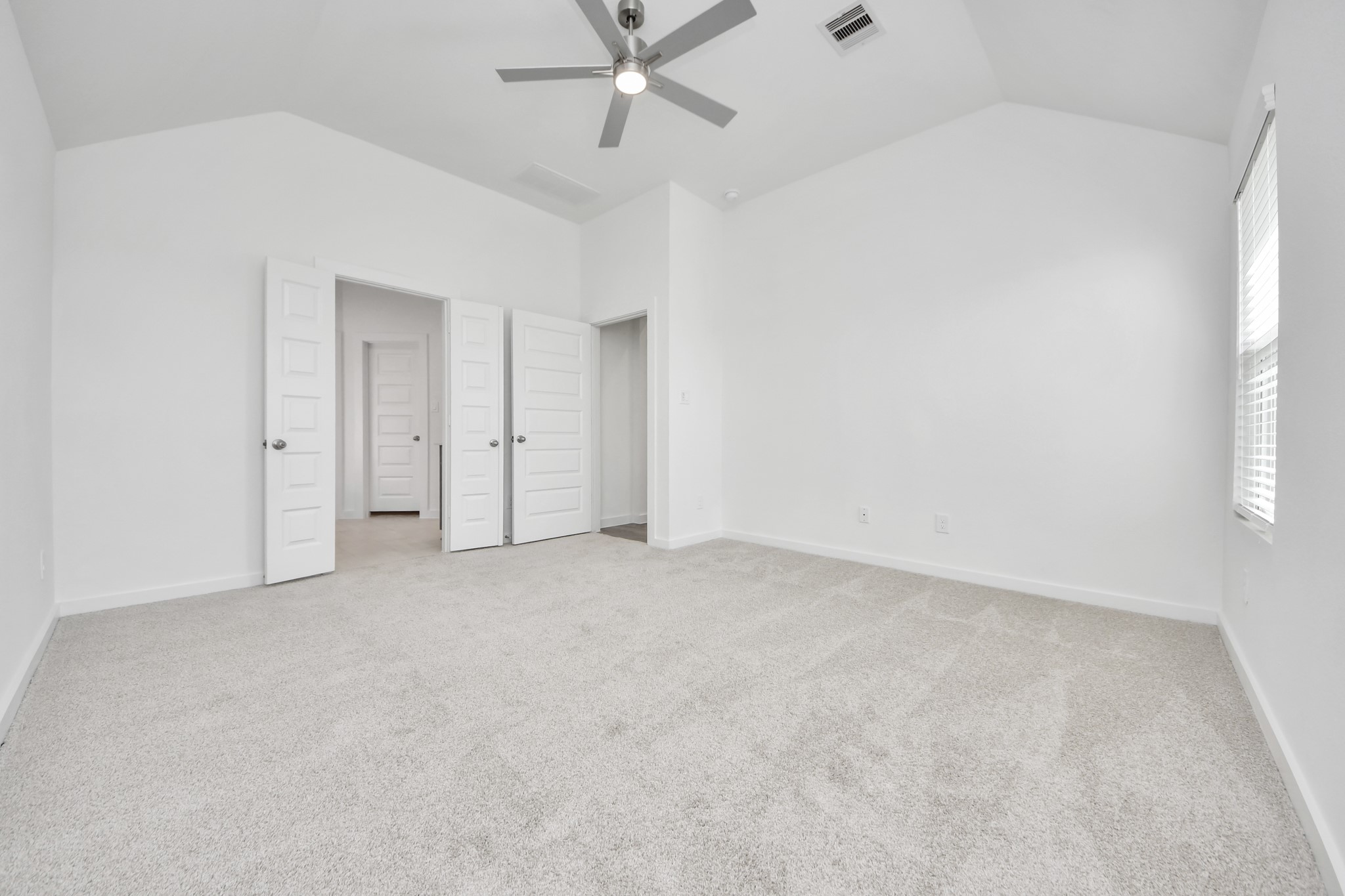 Retreat to the luxurious primary suite, your perfect escape for unwinding after a long day. Sample photo of completed home with similar floor plan. Actual colors and selections may vary.