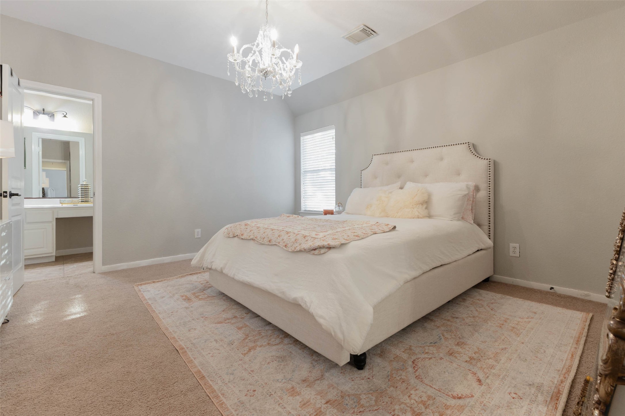 Soft neutral tones and natural light create a sophisticated retreat.