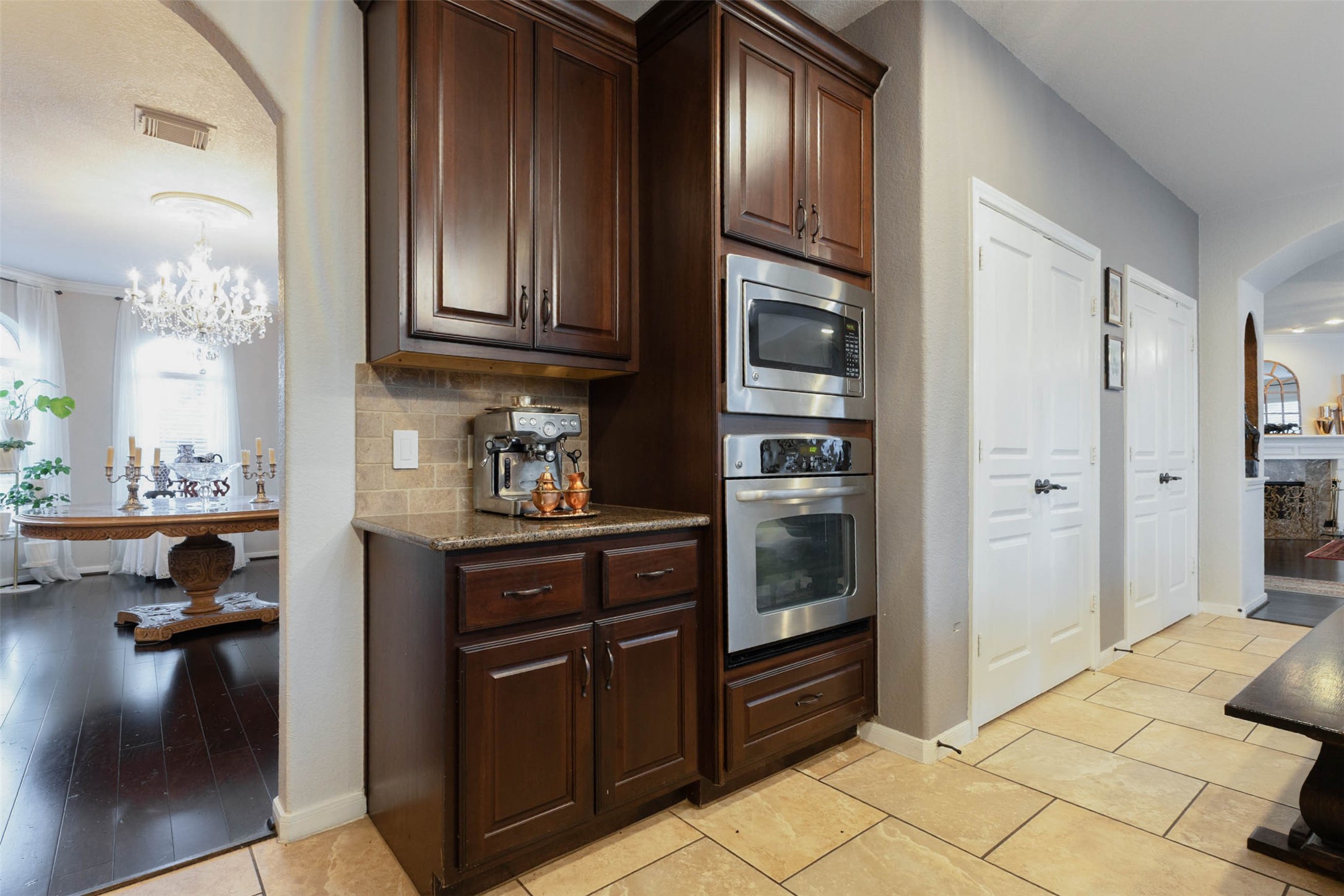 Stainless steel built-in appliances, abundant cabinetry & a dedicated beverage station combine convenience with a beautifully coordinated design.