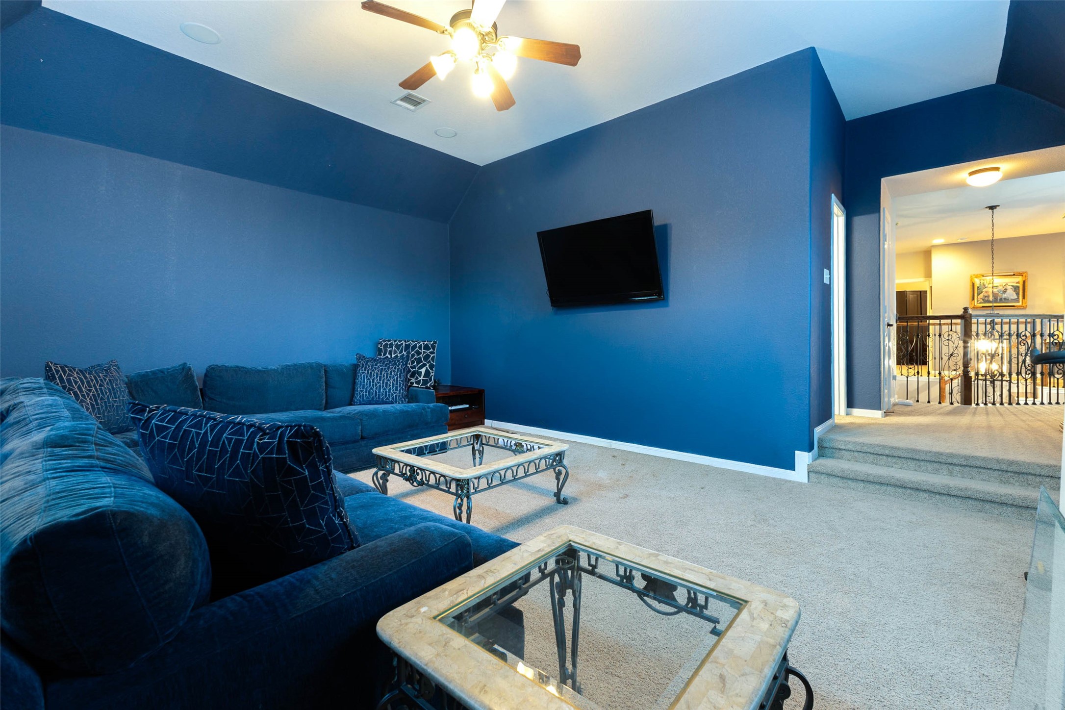 Tucked away from the main living areas, this versatile sunken in retreat provides a comfortable setting for recreation or quiet downtime.