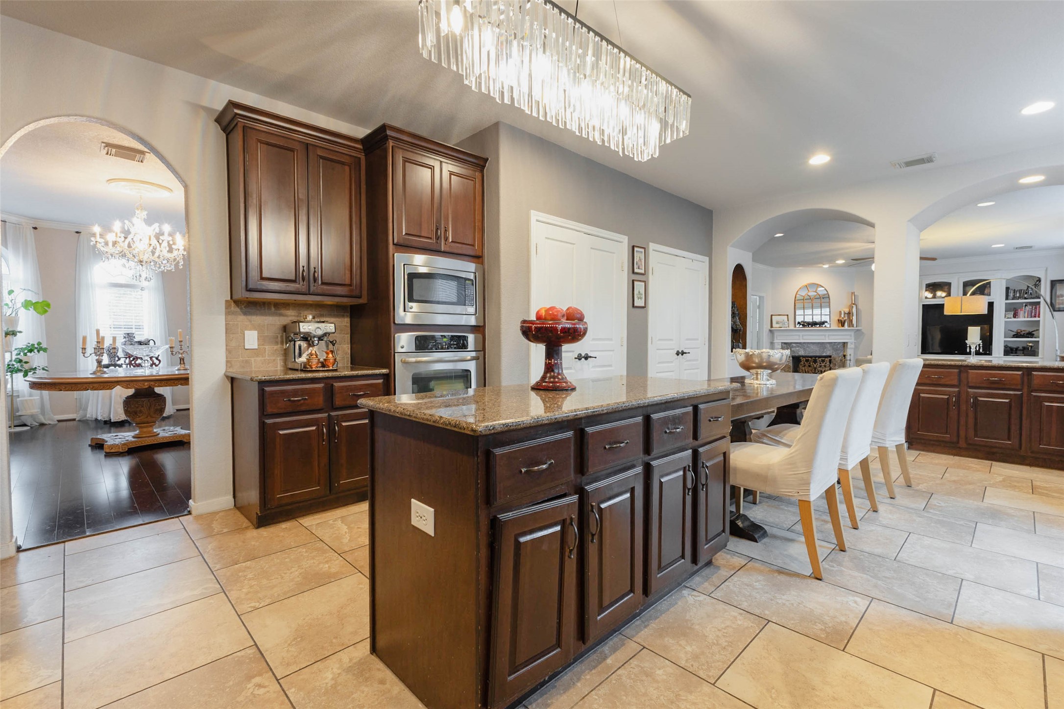 A custom center island offers the perfect setting for casual seating, effortless serving & entertaining, making the kitchen a natural gathering place at the heart of the home.