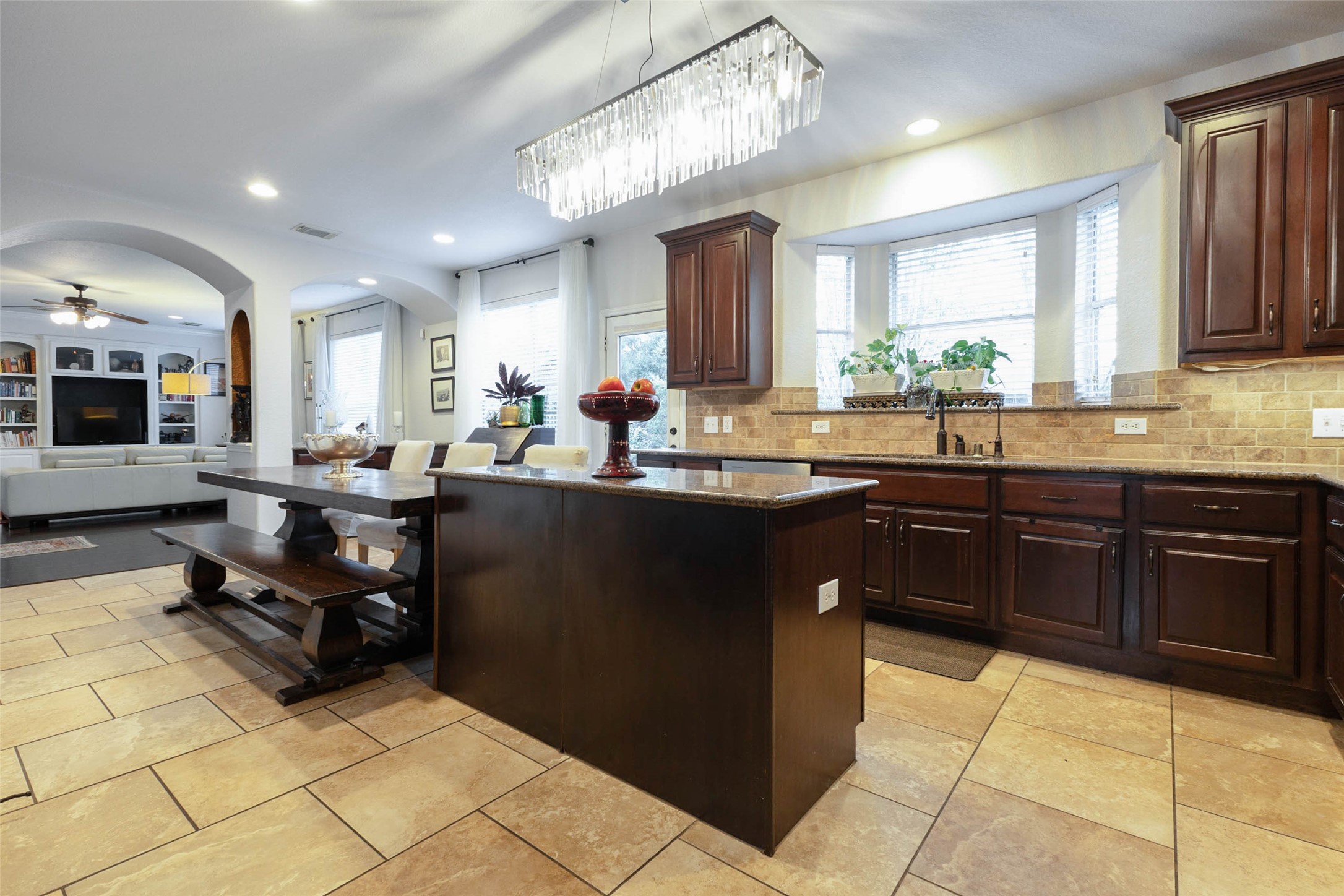 An open connection to the family room allows conversation to flow naturally between cooking, dining & gathering spaces.