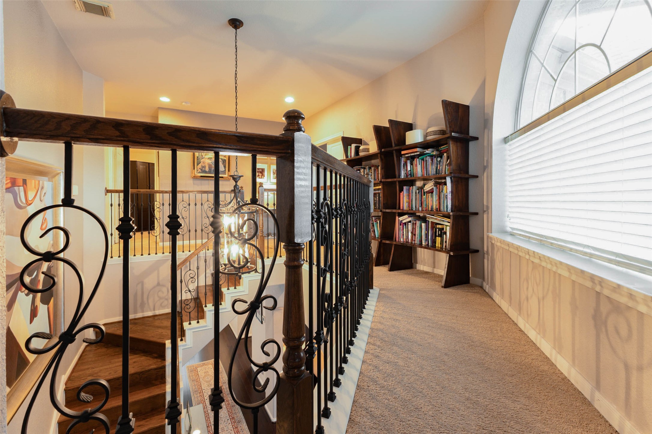 Elegant detailing lead to the game room through this upper-level landing.