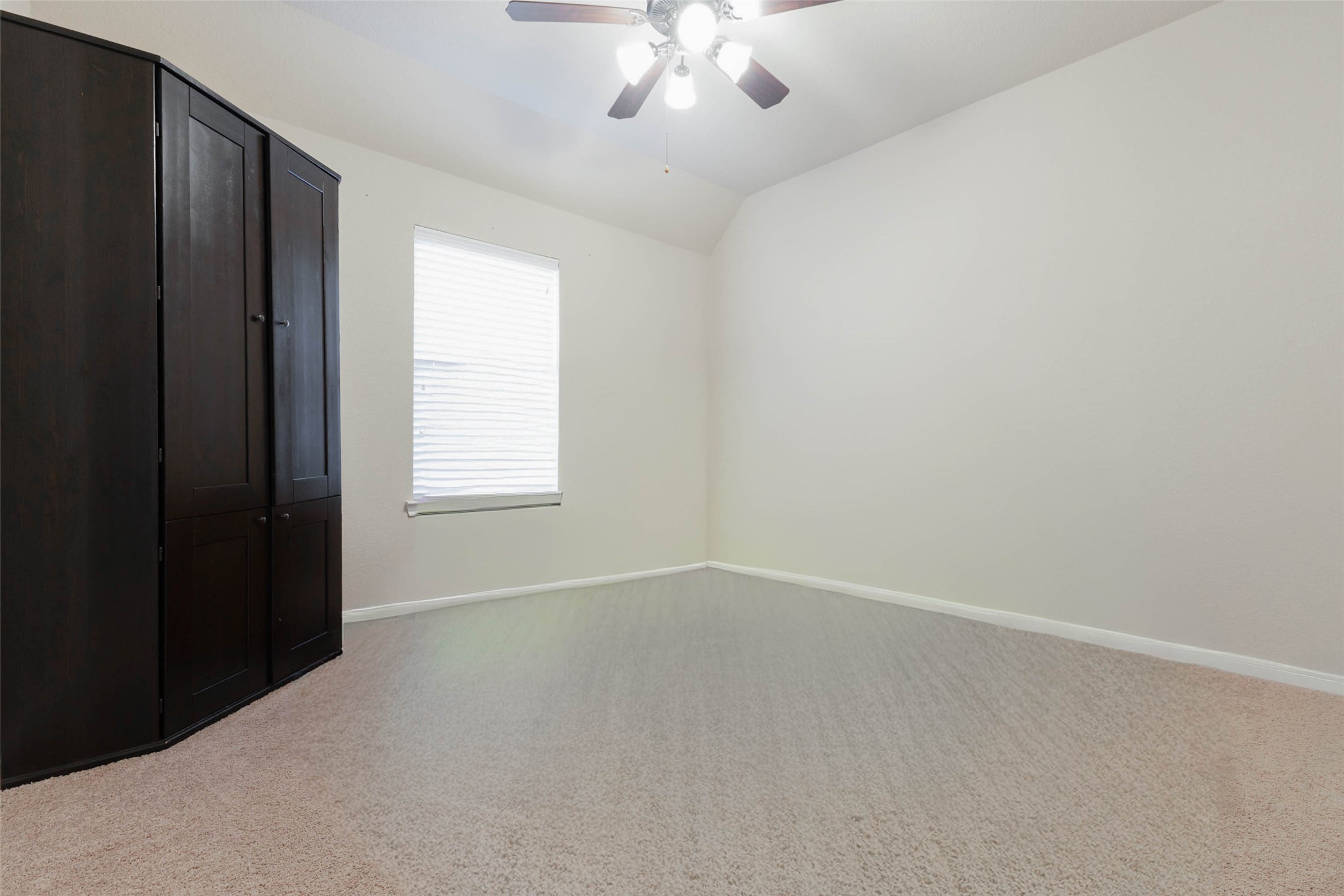 Ample space to accommodate any personal style in this secondary bedroom.