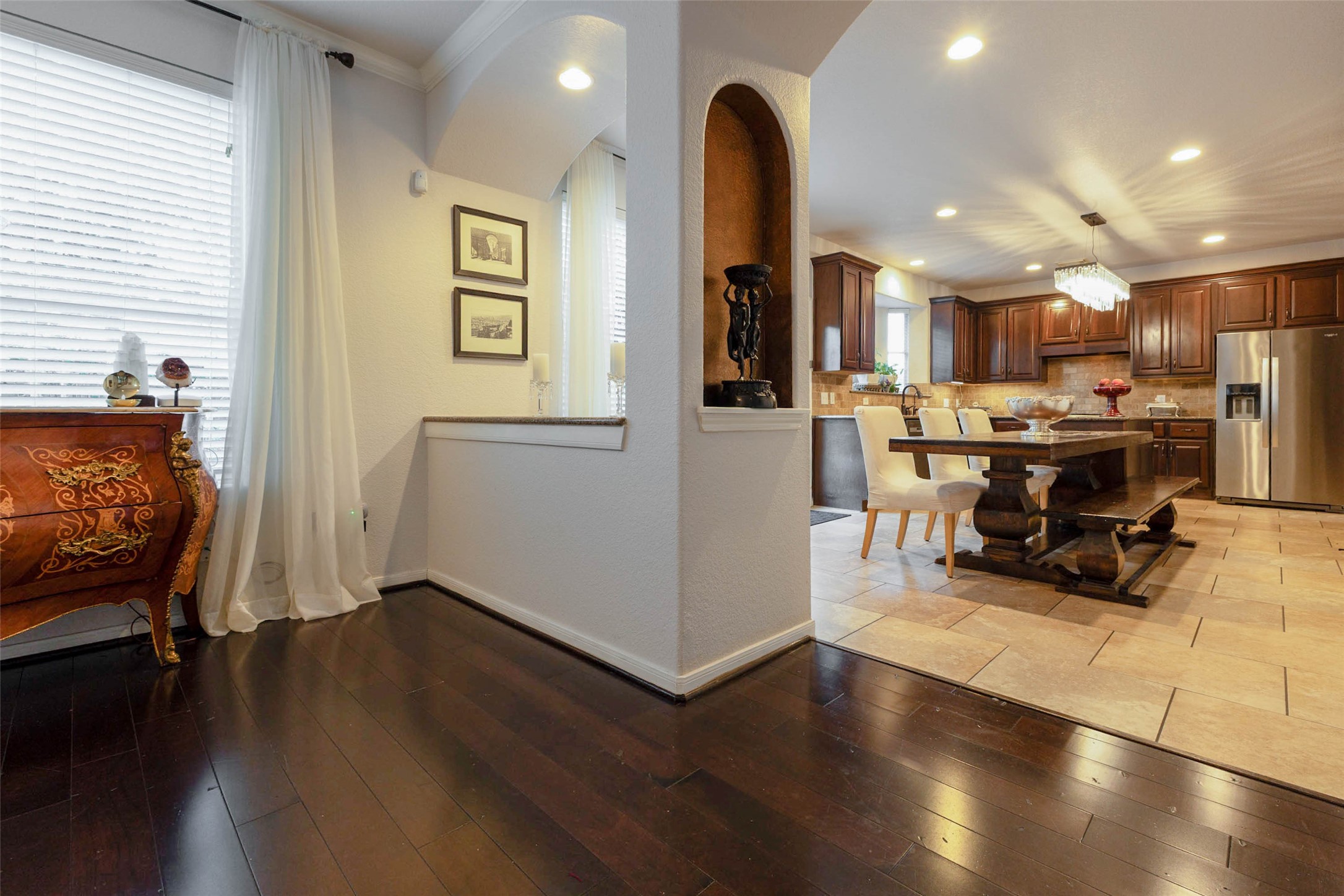 Warm wood cabinetry, recessed lighting & a generous dining area create a welcoming setting for casual meals & lively conversation.