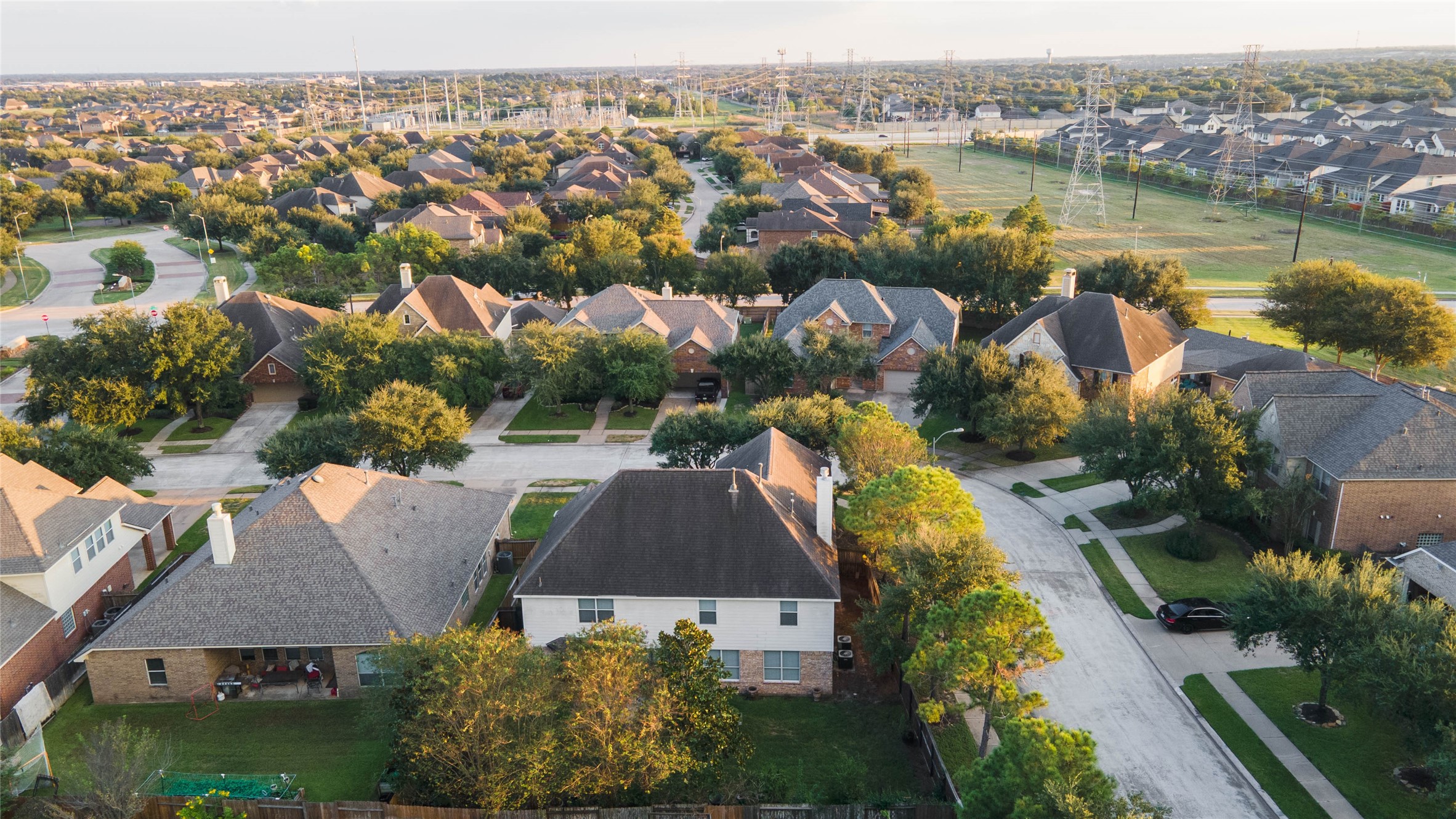 Complete the picture with Cinco Ranch's beautifully established neighborhoods, mature trees, golf courses, tennis courts, and convenient access to shopping, dining, and entertainment at LaCenterra at Cinco Ranch.