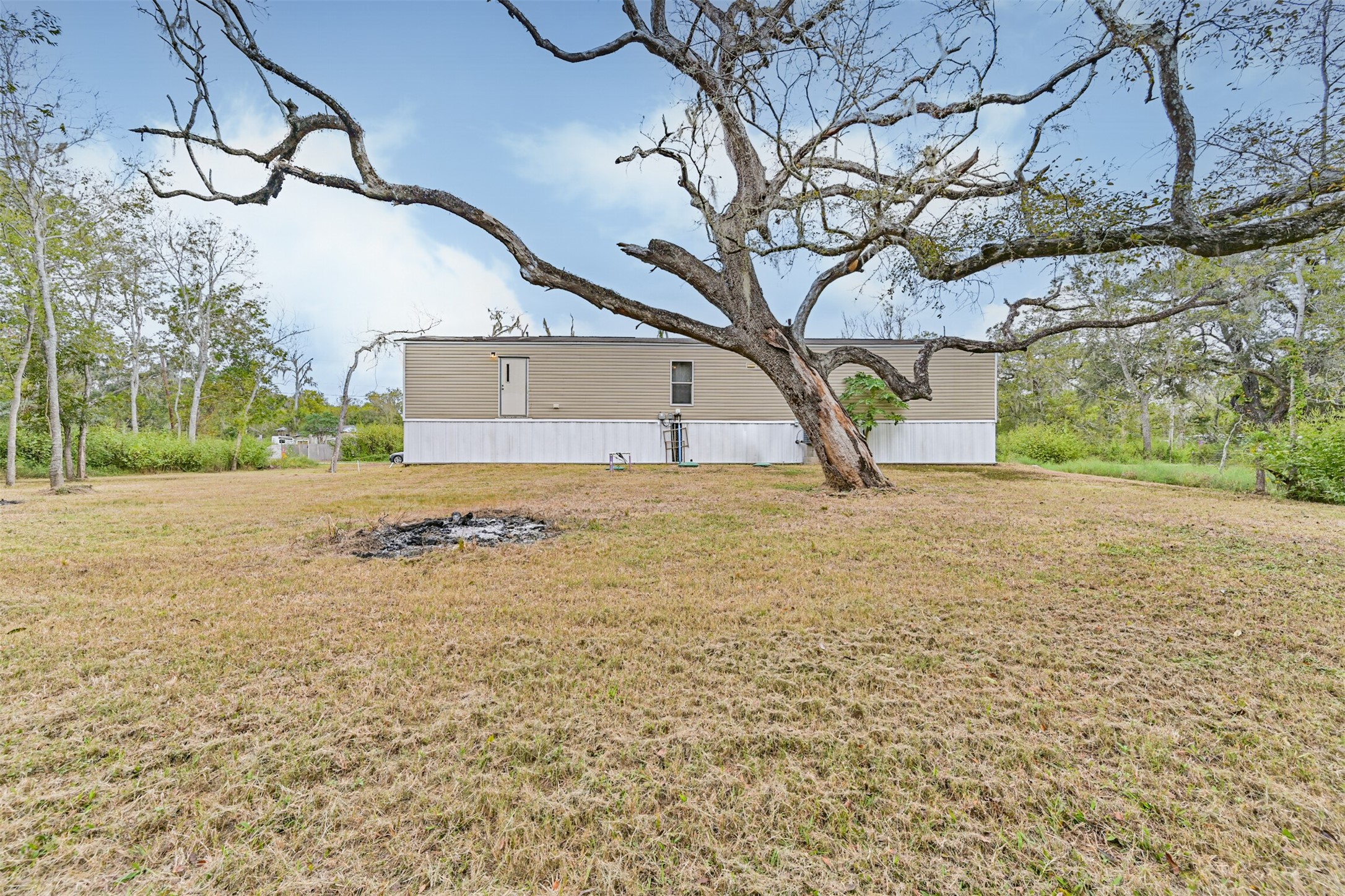 Plenty of room for a garden or chicken coop or both.