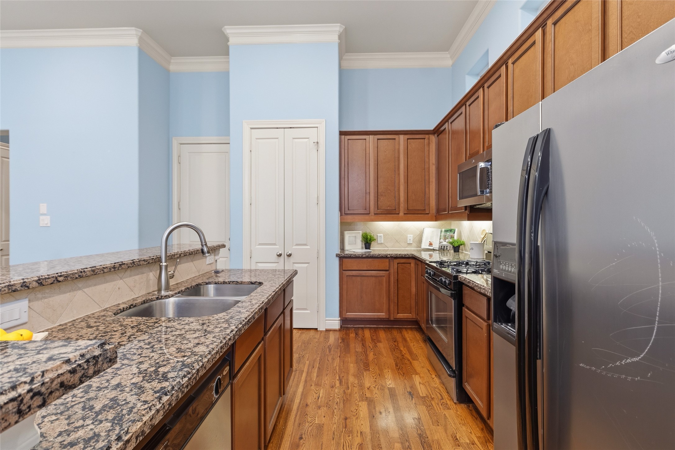 You move through a kitchen thats built for function, with plenty of counter space, storage, and a layout that keeps everything within reach. Its easy to stay organized while still being part of the conversation.