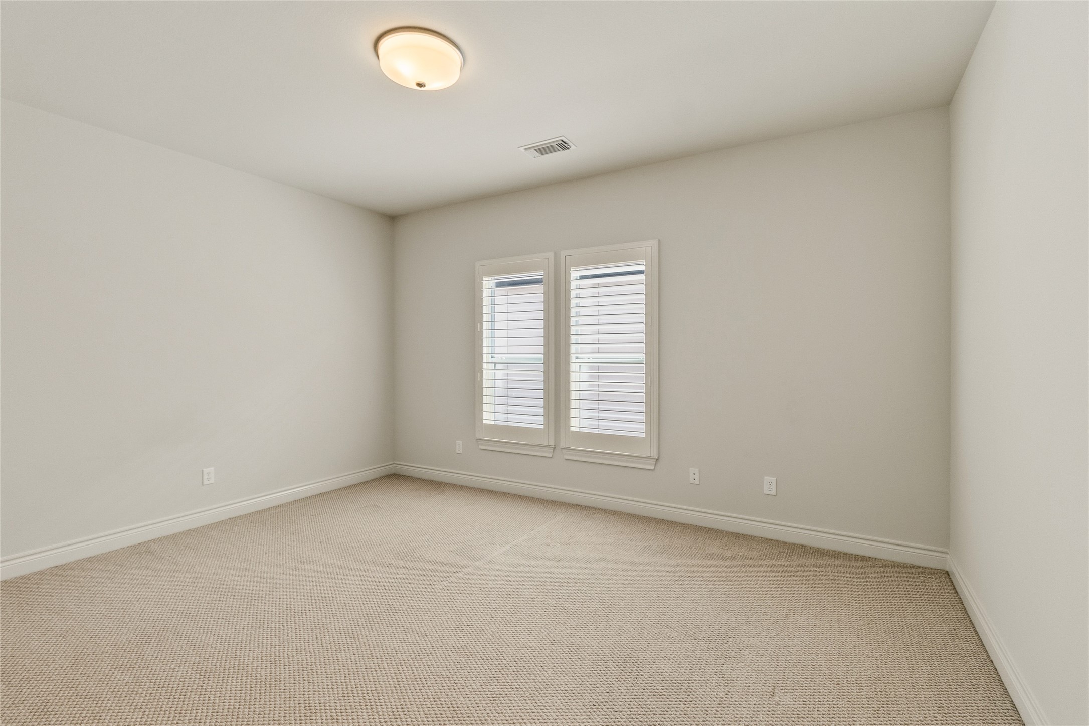 Youve got a bright, open bedroom here thats ready to adaptwhether its for guests, family, or a second workspace. The natural light keeps it feeling fresh without needing anything extra.