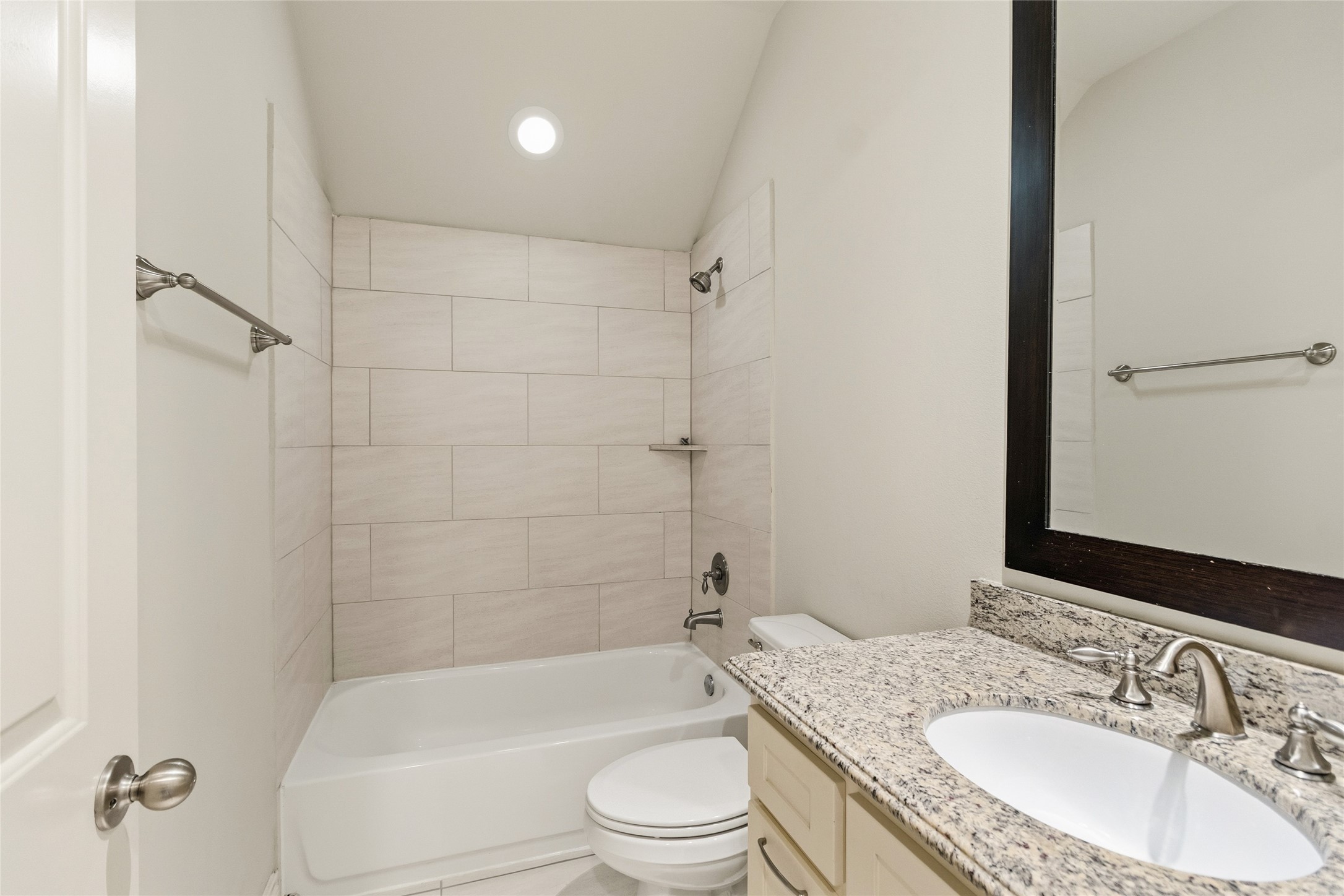 Youve got a full bathroom thats clean, bright, and ready for daily routines, with a granite vanity and a tiled tub/shower combo that keeps everything simple. Its the kind of space that just works without any extra effort.