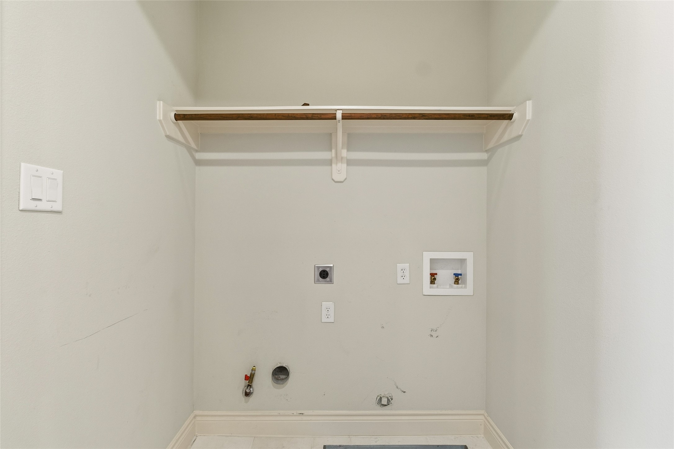 Youve got a dedicated space for laundry that keeps things organized and out of sight, with room to set up exactly how you like it. Its practical, straightforward, and one less thing to think about.