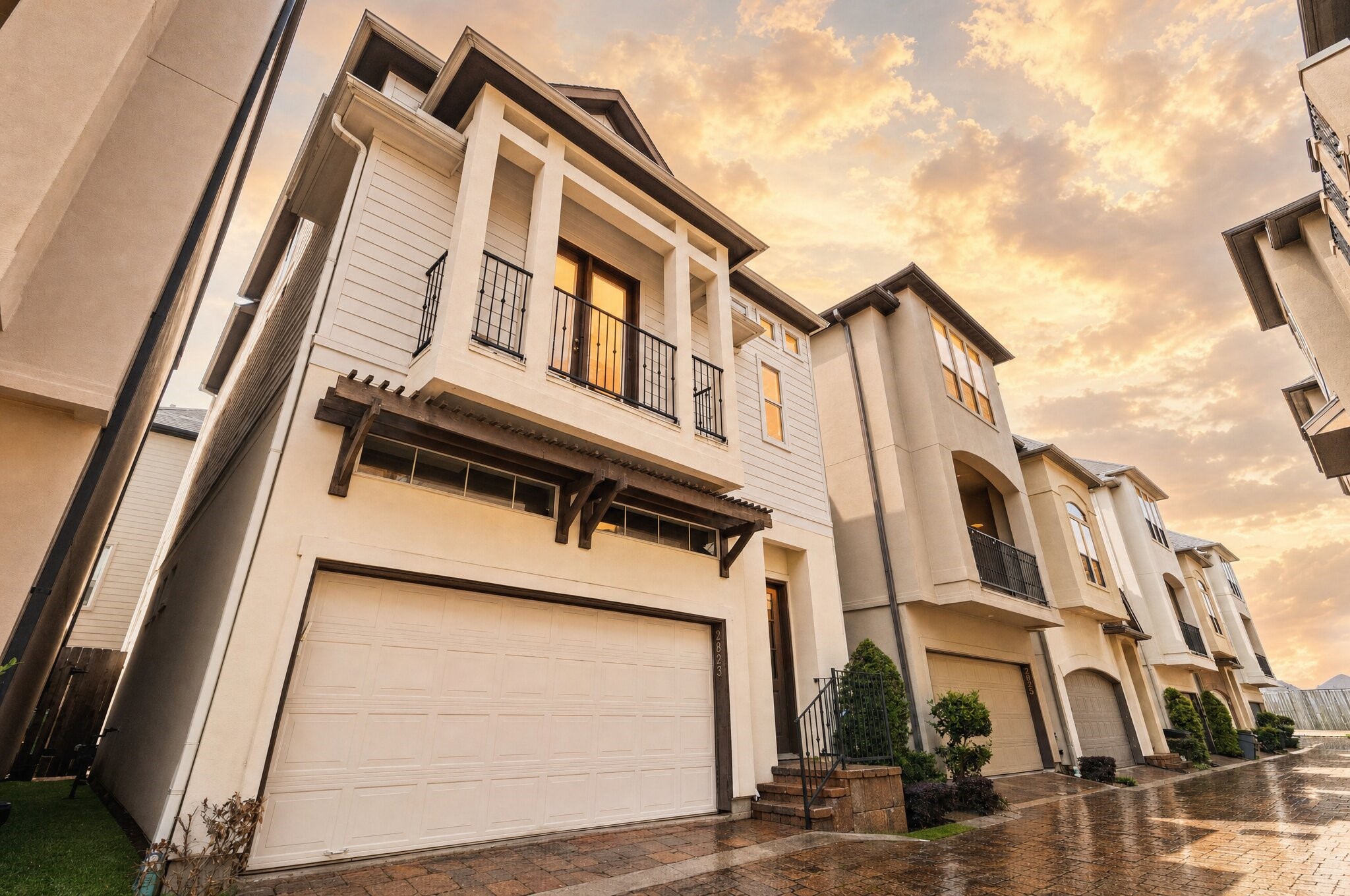 From this angle, you really appreciate how your home sits tucked into the community while still holding its own with style. The elevated entry, detailed trim work, and inviting front door create a natural sense of arrival every time you come home. This photo has been virtually adjusted using artificial intelligence.