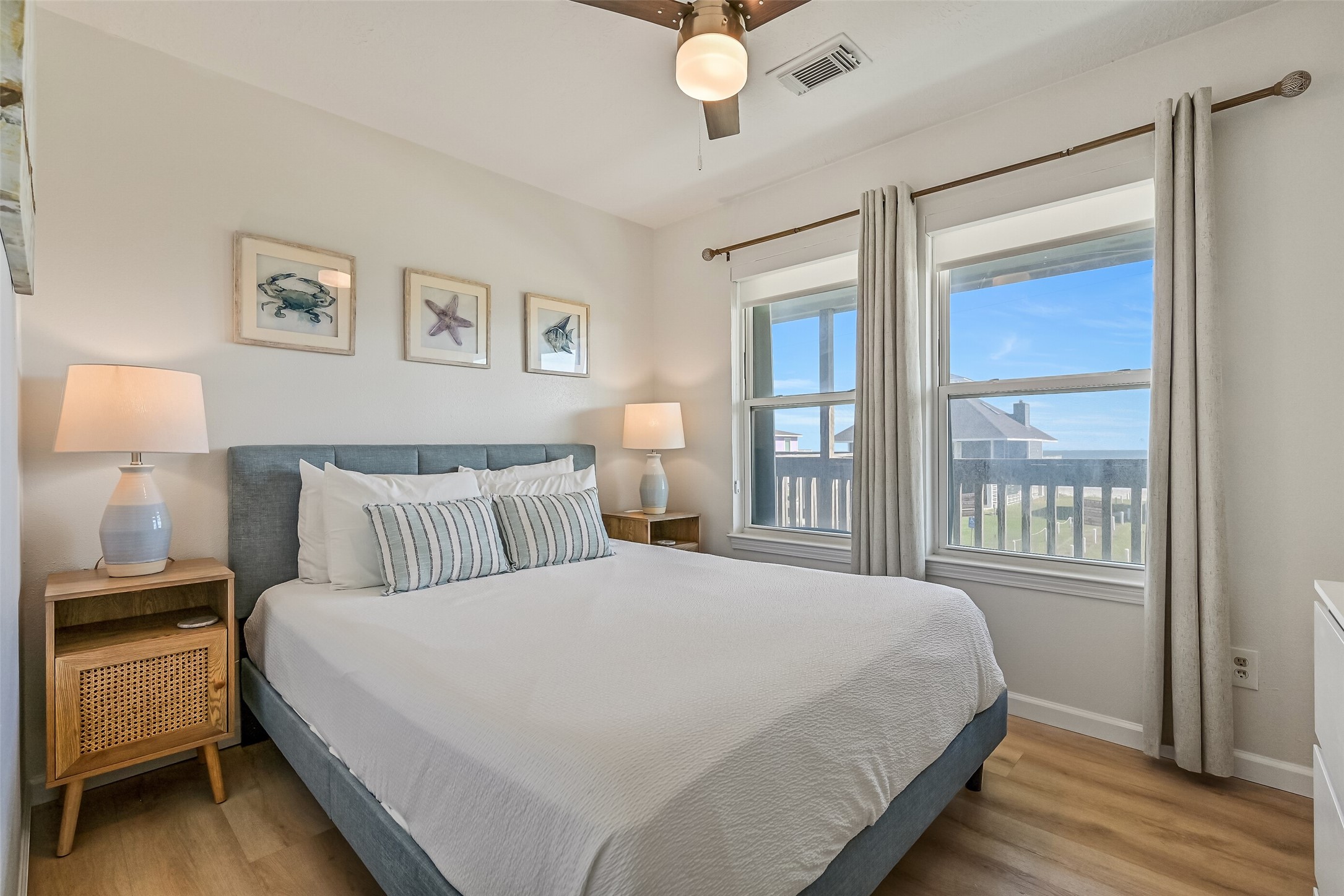 The first of two guest bathrooms  hosts a queen bed and is conveniently situated between the guest bedrooms, offering easy access and added convenience.