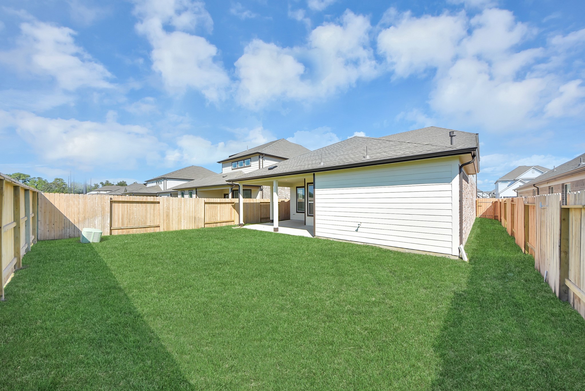 Come and see this spacious backyard with its beautiful covered patio. There is plenty of room for the kids to play and adults to relax. Perfect for your outdoor living space, patio furniture, bbq pit, and so much more. The possibilities are endless!
