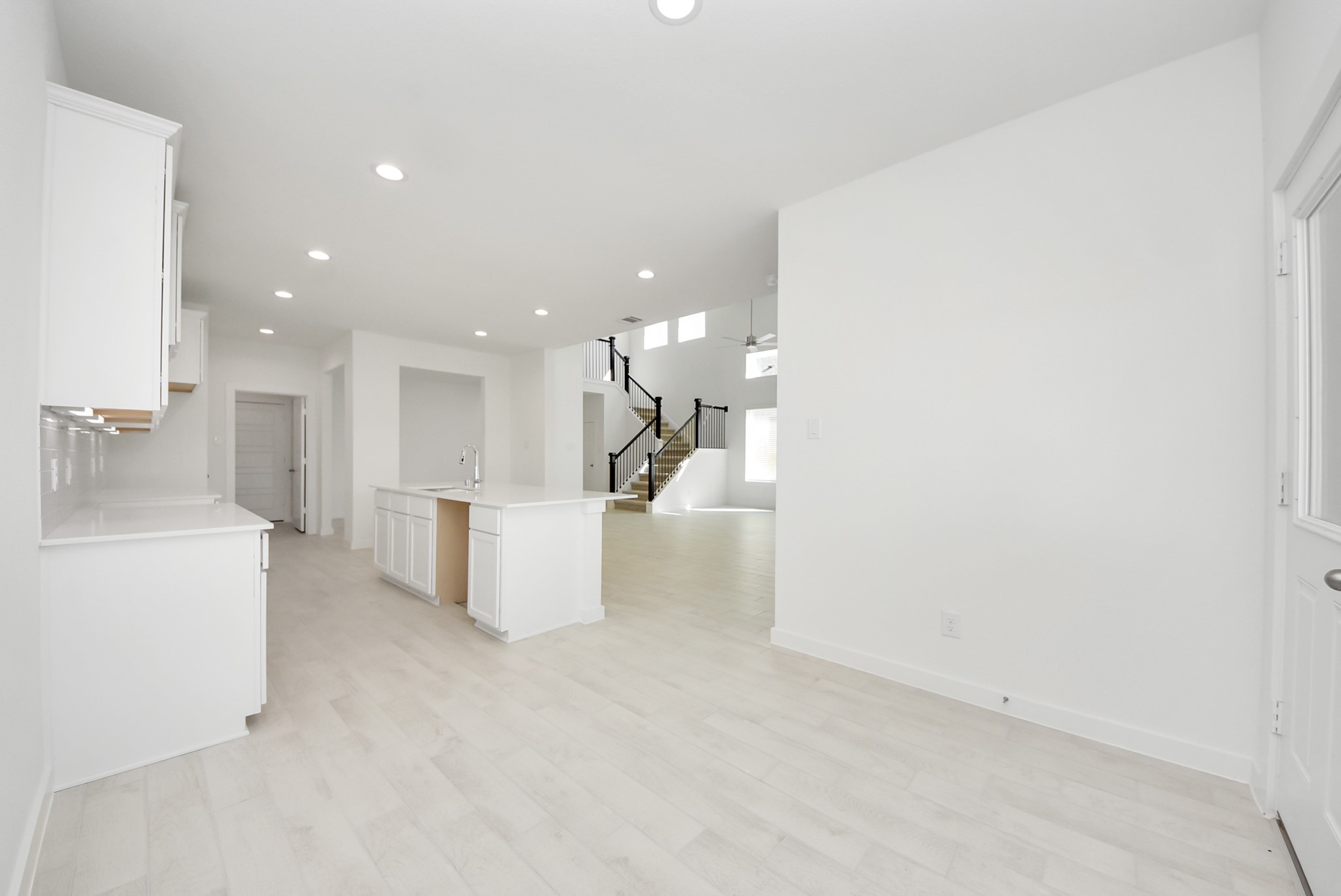 Enjoy breakfast with ease in the connected and cozy breakfast area, seamlessly integrated with the kitchen for utmost convenience. Step through the back door for a breath of fresh air onto the covered patio, extending your living space to the outdoors