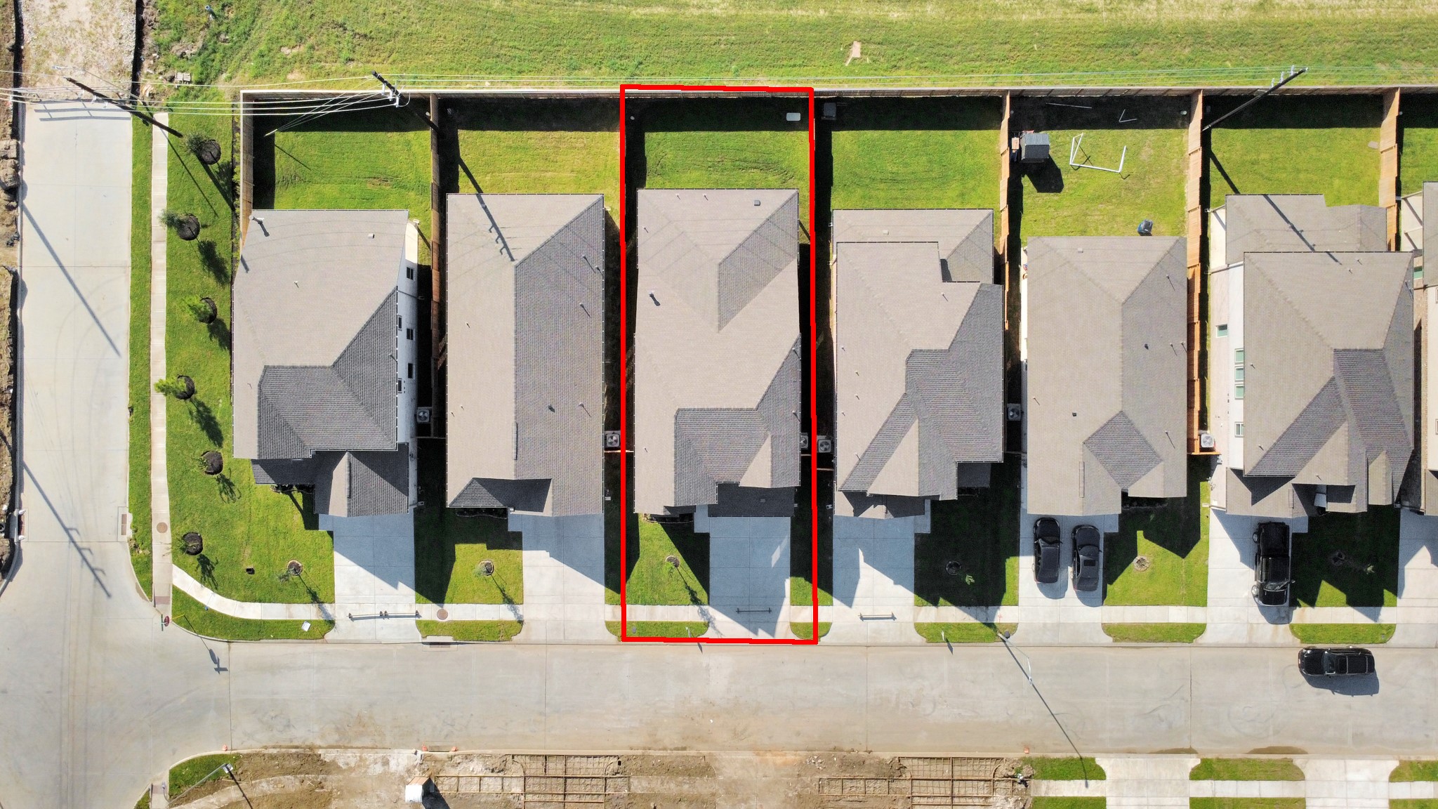 An aerial view of a spacious subdivision lot, highlighting a well-maintained yard and a fully fenced perimeter, offering both privacy and expansive outdoor space. An aerial view of a spacious subdivision lot, highlighting a well-maintained yard and a fully fenced perimeter, offering both privacy and expansive outdoor space.