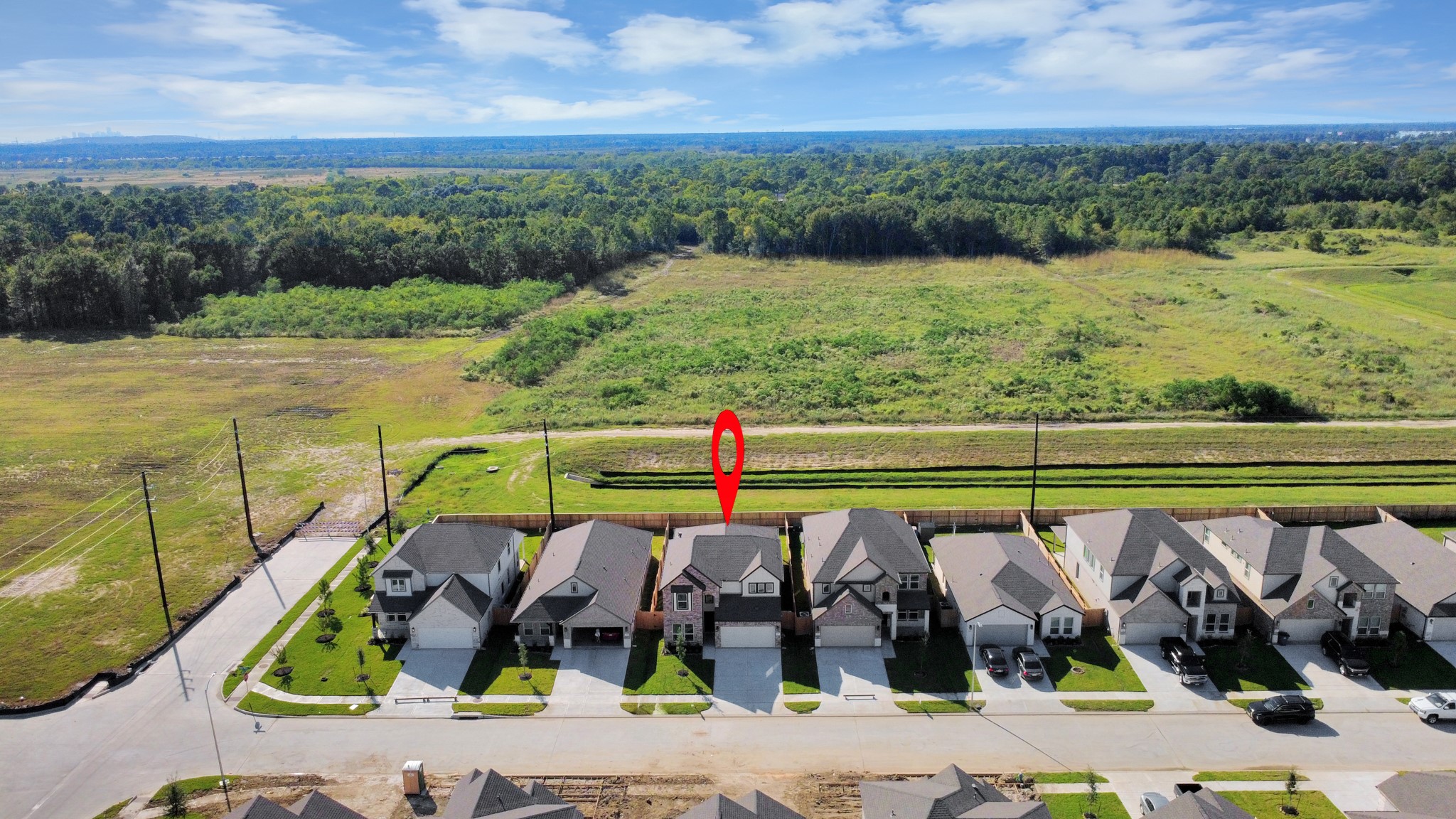 An aerial view of a spacious subdivision lot, highlighting a well-maintained yard and a fully fenced perimeter, offering both privacy and expansive outdoor space. An aerial view of a spacious subdivision lot, highlighting a well-maintained yard and a fully fenced perimeter, offering both privacy and expansive outdoor space.