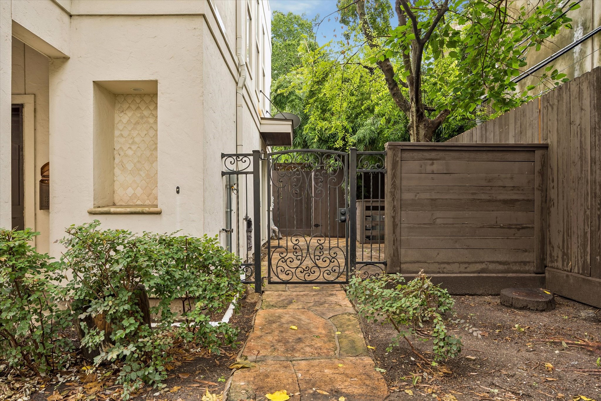 The front door is located through a peaceful gated courtyard. The front door is located through a peaceful gated courtyard.