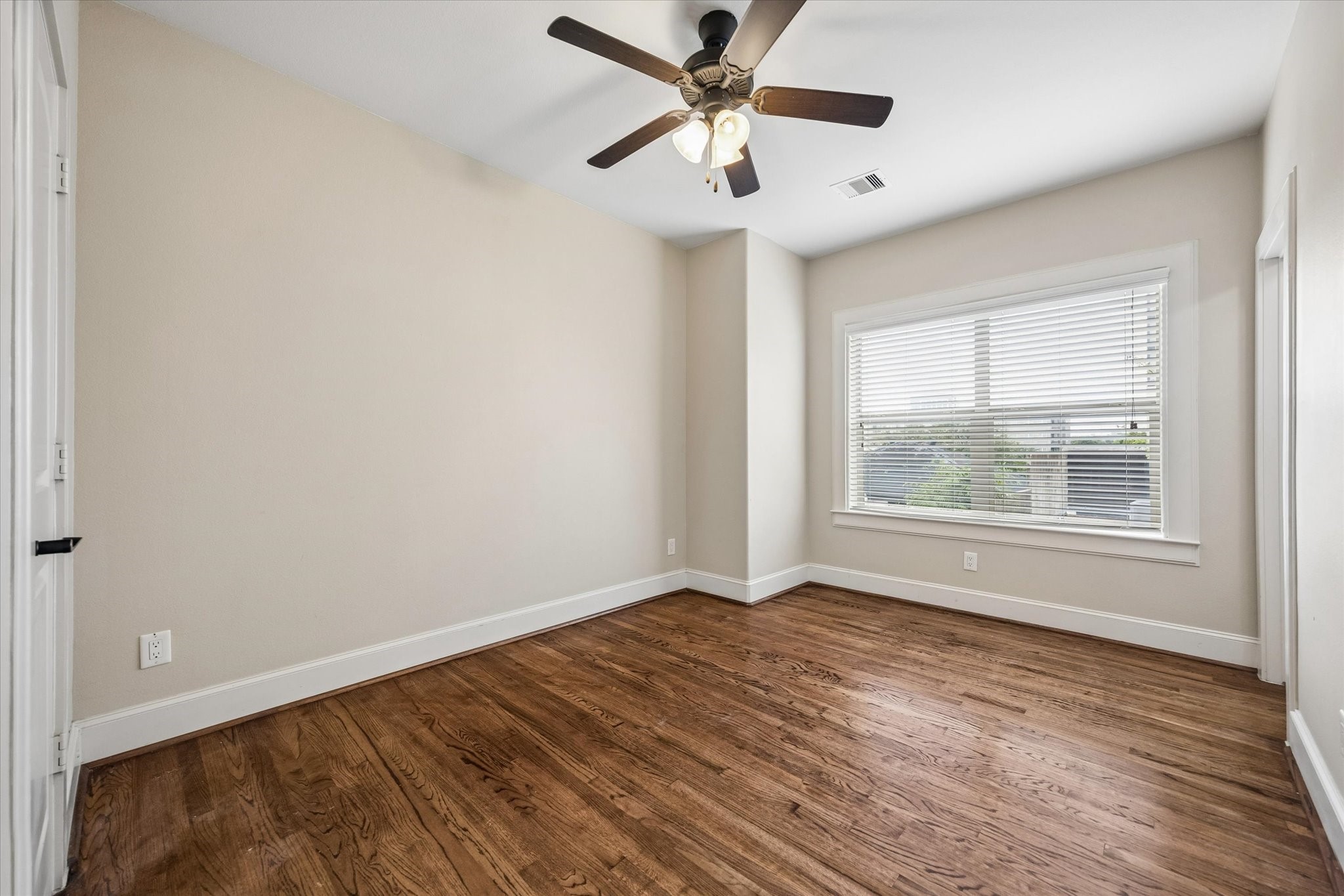 This bright secondary bedroom is located on the third floor and features an en-suite bath and walk-in closet.