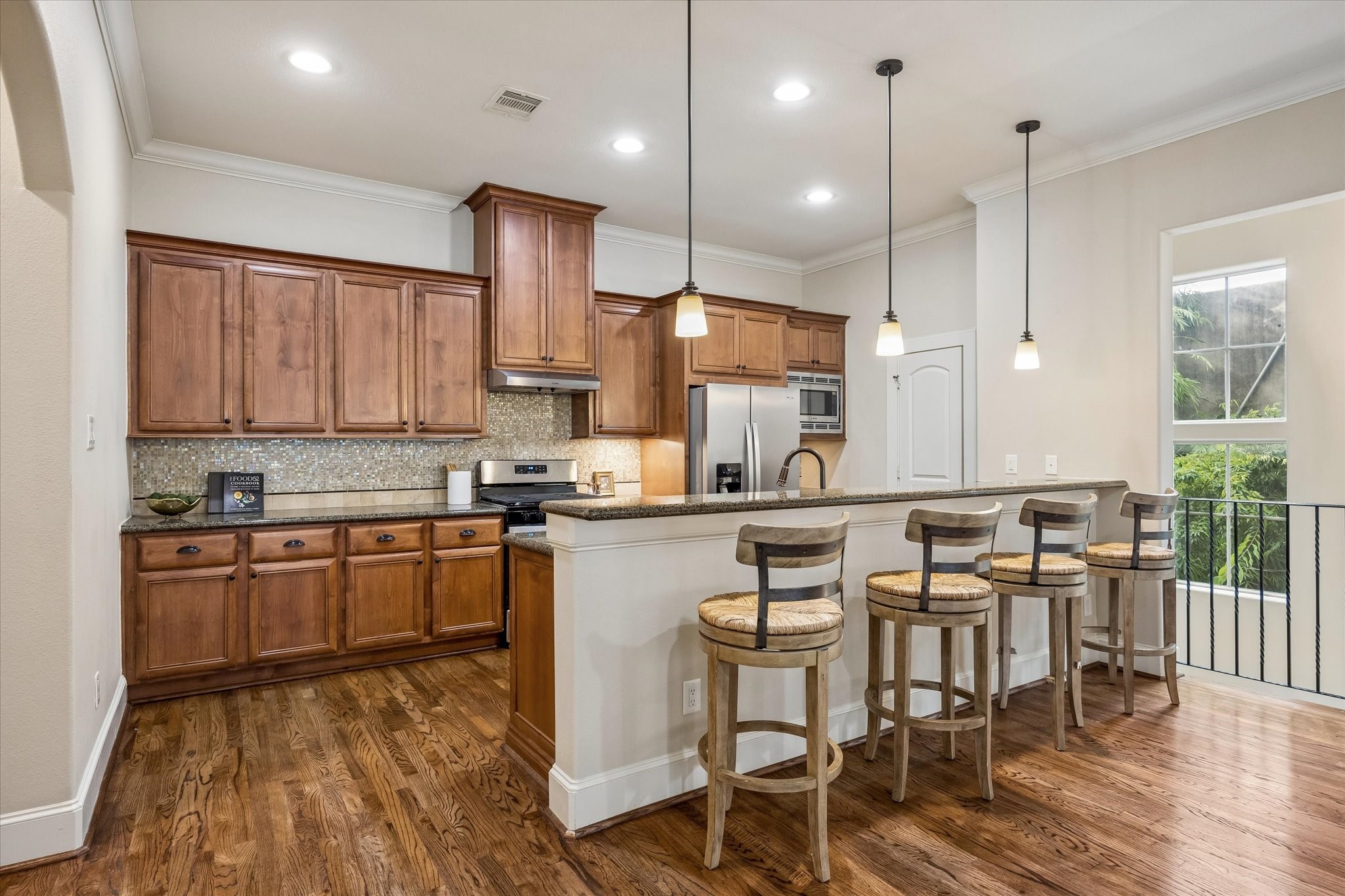 The kitchen offers new appliances, granite countertops, a breakfast bar and walk-in pantry.