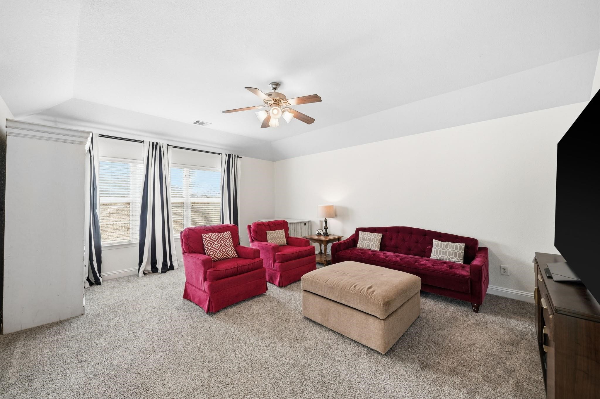 Designed for entertaining and unwinding, the game room combines comfort and style with soft carpet, a tray ceiling, and balcony access overlooking the grand family room. Whether hosting friends or enjoying a quiet evening in, this versatile space adapts effortlessly to your lifestyle. In 2023 new blown-in attic insulation was added.