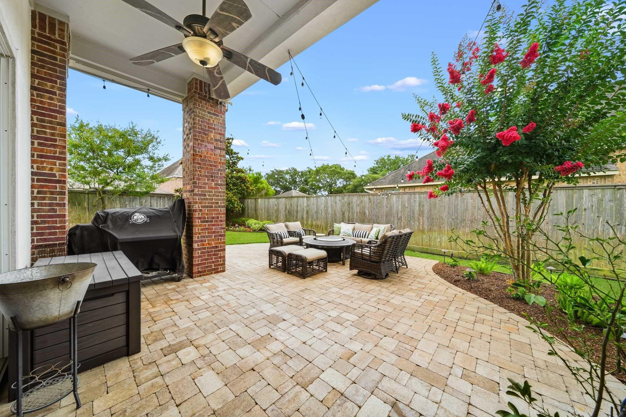 The expansive brick paver patio extends well beyond the covered porch, creating an exceptional outdoor living space perfect for entertaining, dining al fresco, or simply enjoying the outdoors. Welcome Home!
