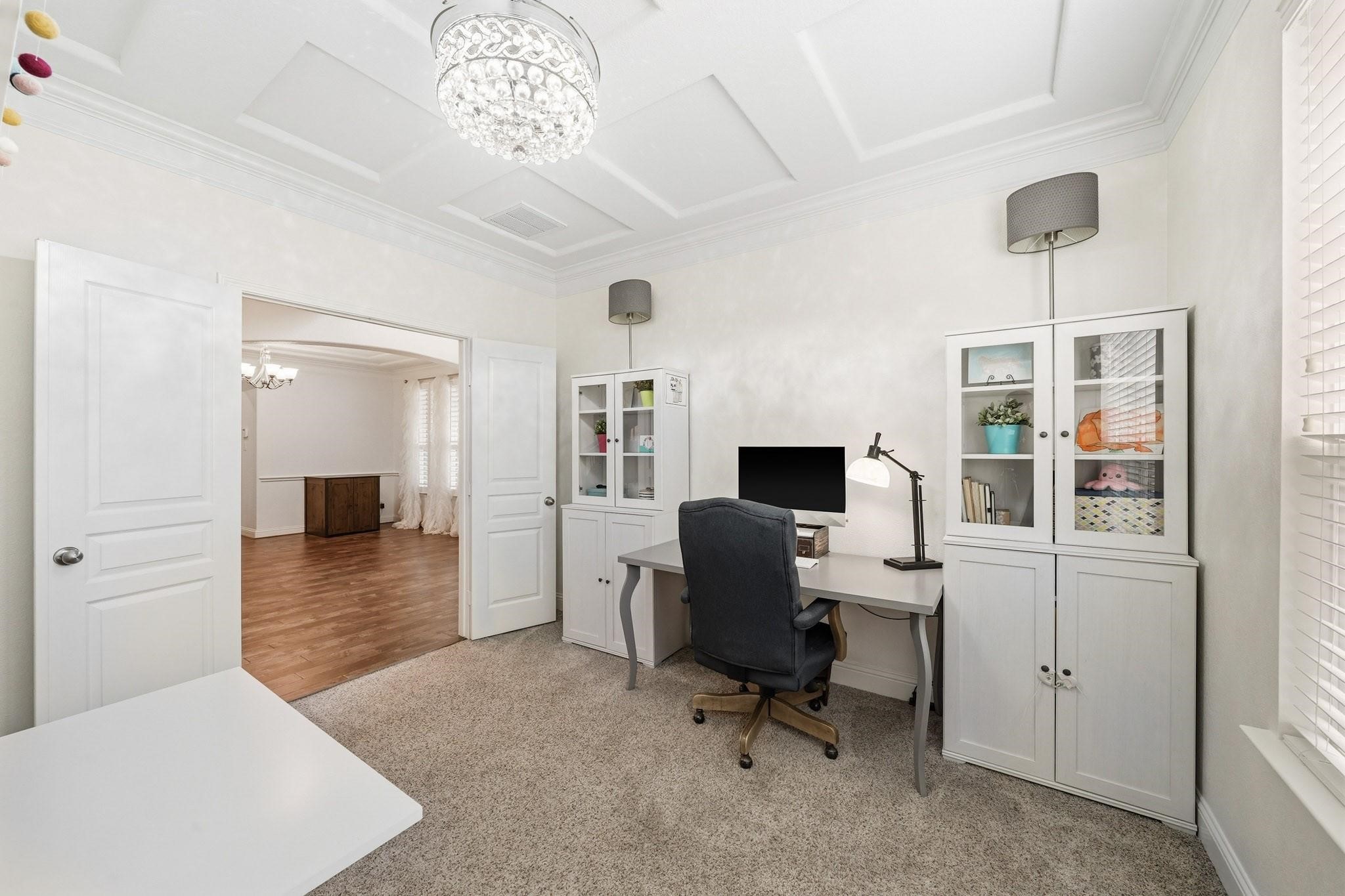 Tucked away from the main living areas, this inviting study offers a quiet escape for remote work, reading, creative pursuits or simply enjoying a peaceful moment. Plush carpeting and sun-filled windows with blinds create a comfortable and private retreat designed for productivity.