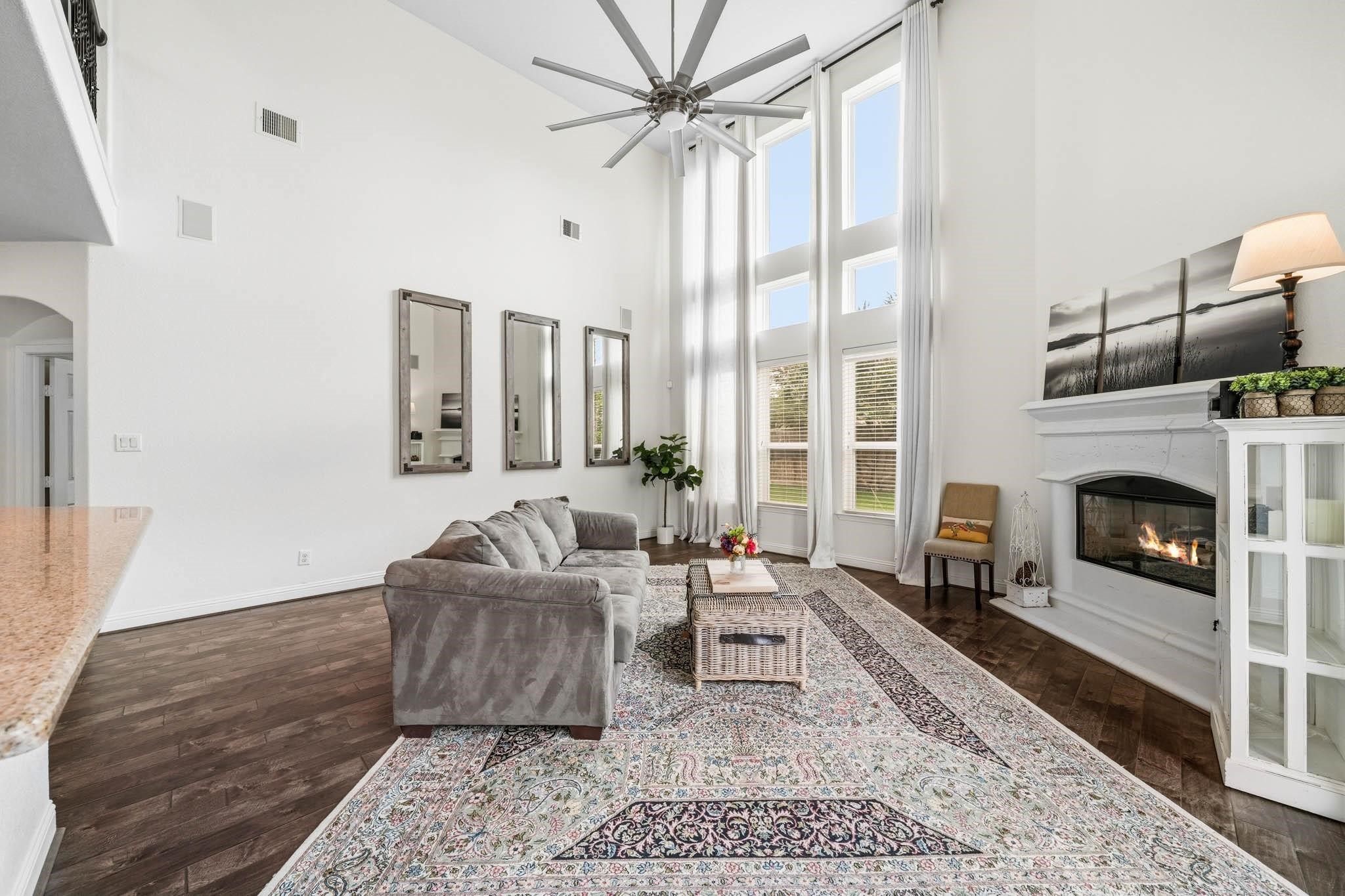 Designed for memorable gatherings, the family room features a beautiful cast stone fireplace and a beautiful 8-blade ceiling fan with integrated light. Designed for memorable gatherings, the family room features a beautiful cast stone fireplace and a beautiful 8-blade ceiling fan with integrated light.