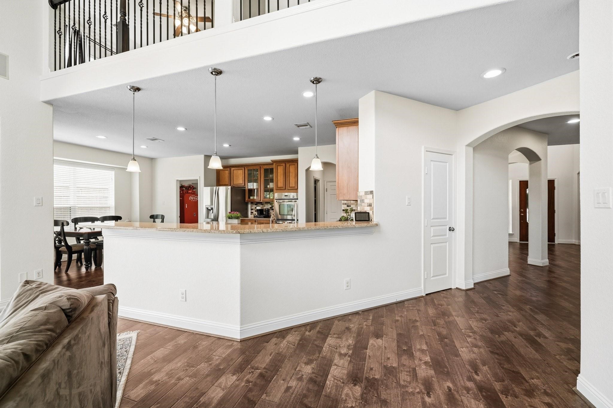 The breakfast bar with pendant lighting offers an inviting space for morning coffee, casual dining, and effortless conversation. Added in 2025 to the home was a new roof, electrical panel with generator hookup, HVAC system and whole home surge Protector. Another new HVAC was added in 2024 along with two new water heaters.