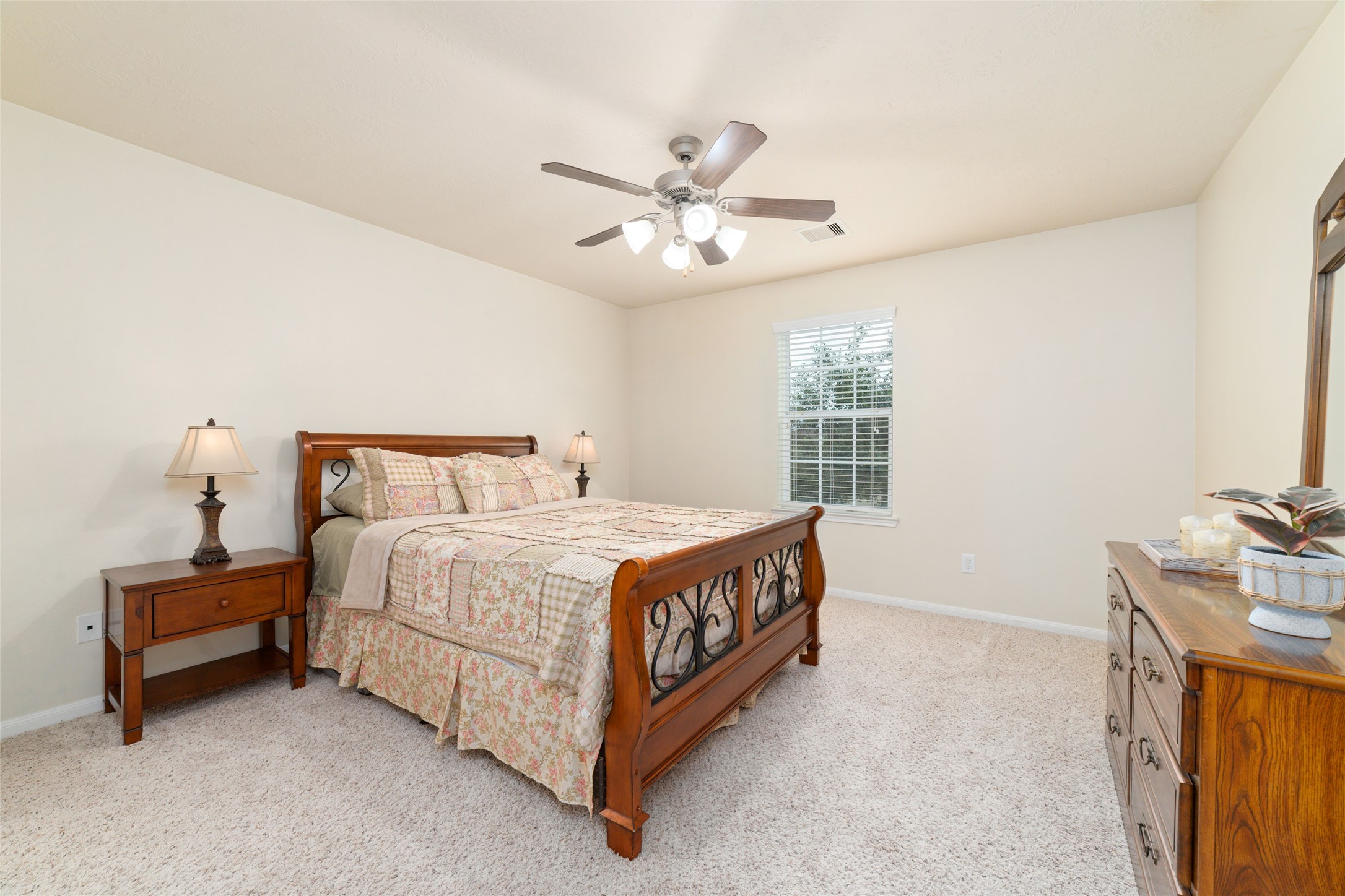 Second upstairs bedroom overlooks the front lawn and is full of natural light; Nice walk-in closet and its own vanity area.