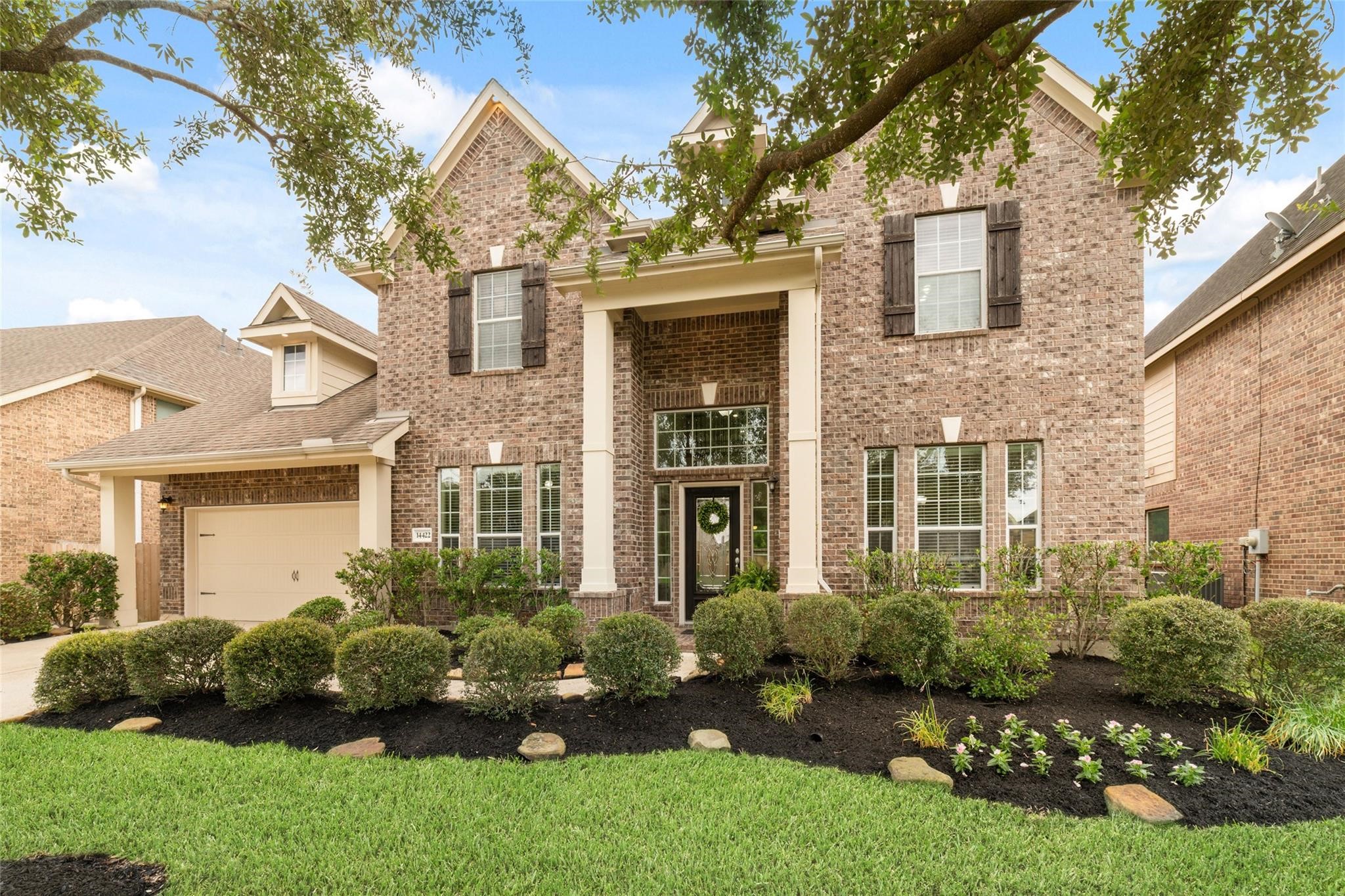 Welcome home! This beauty boasts charming curb appeal with mature landscaping and welcoming front entry