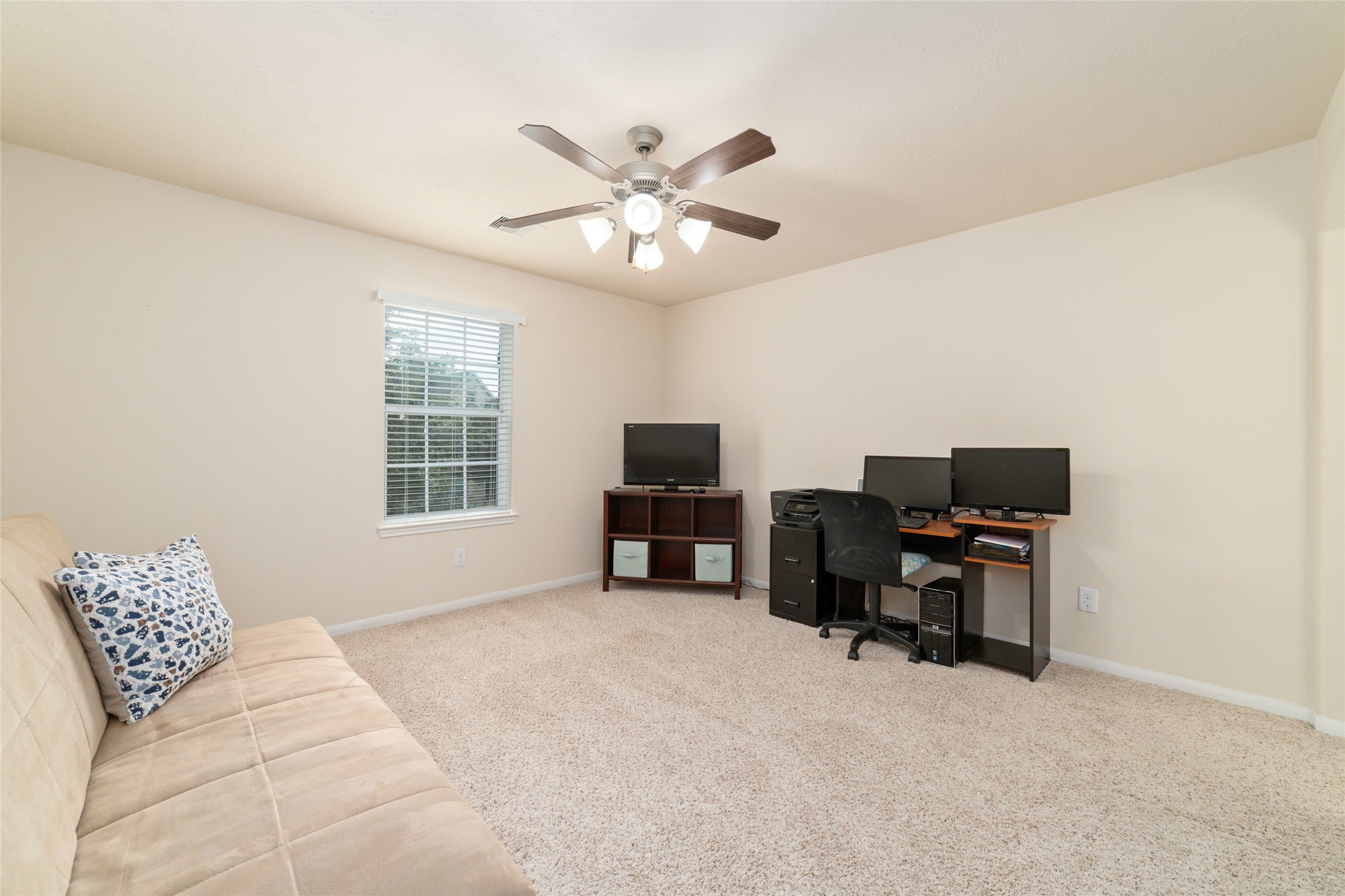This is the third of the four upstairs bedrooms currently being used as a hobby room.