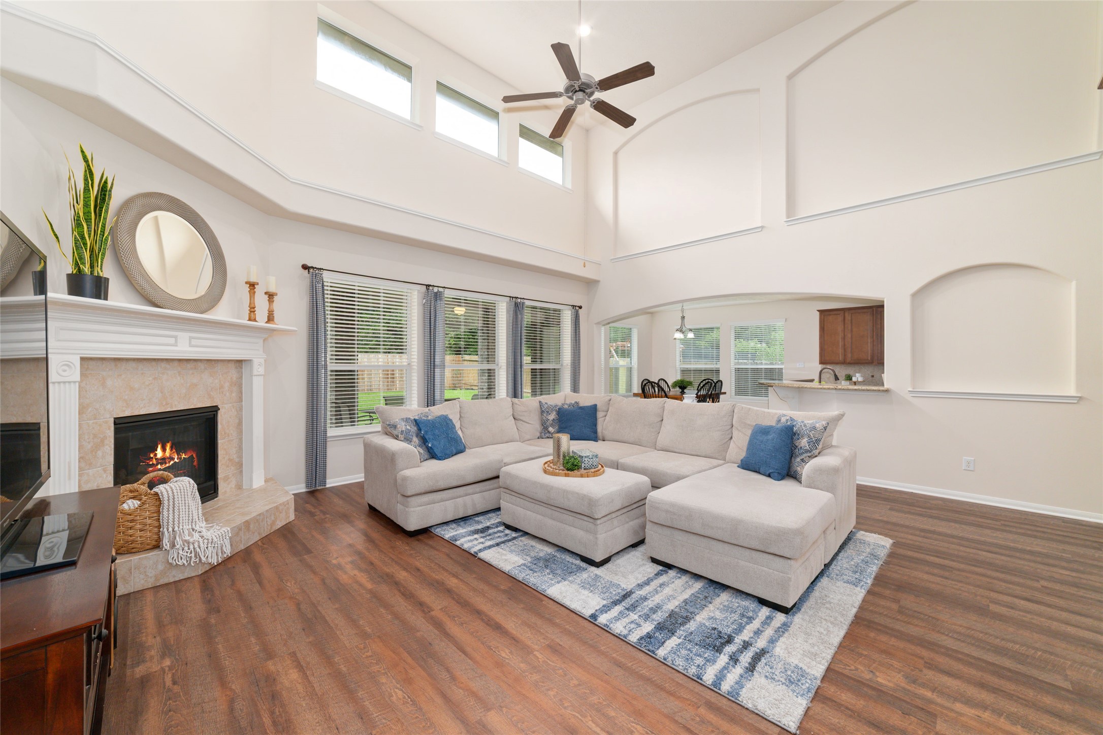 Open living area with elevated ceilings and comfortable flow