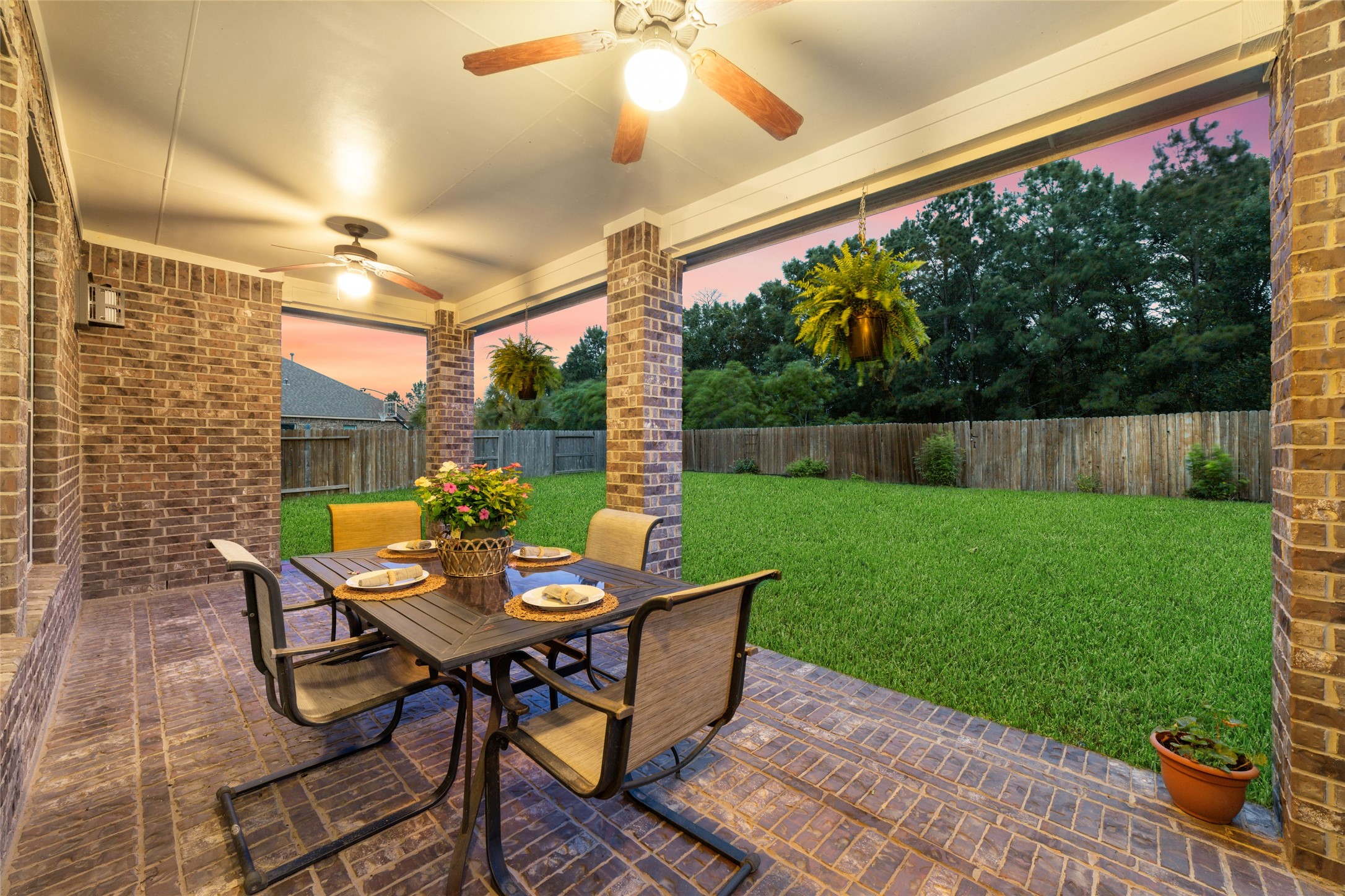 Huge covered patio with two ceiling fans, great for gatherings, play and pets