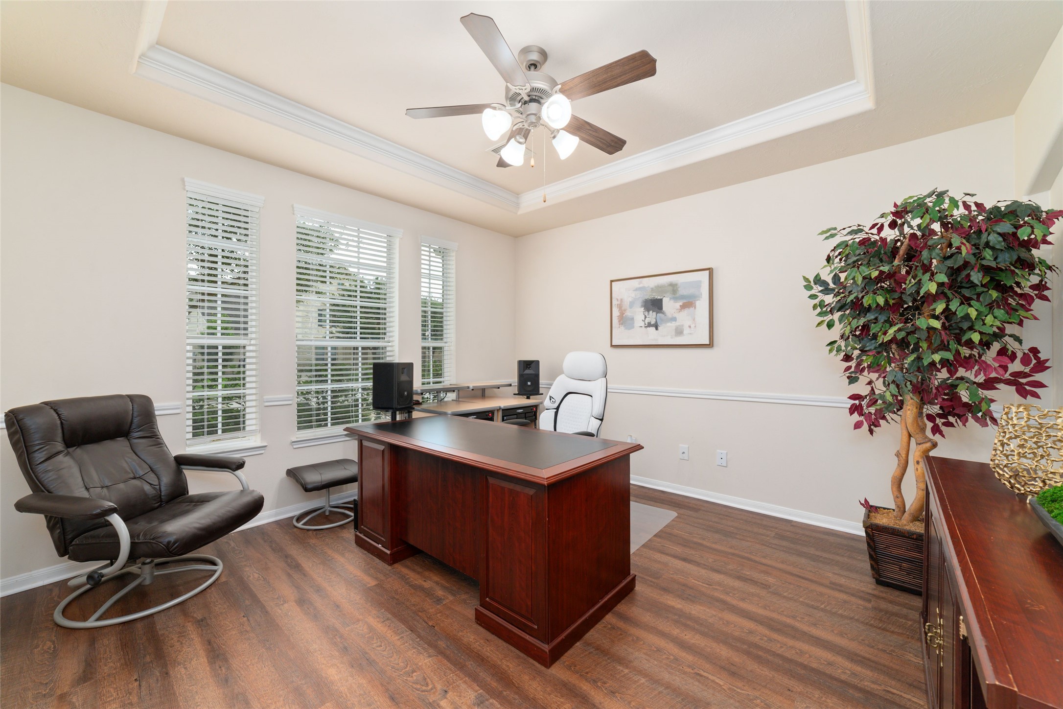 Private and spacious home office with French doors, overlooking the front lawn.